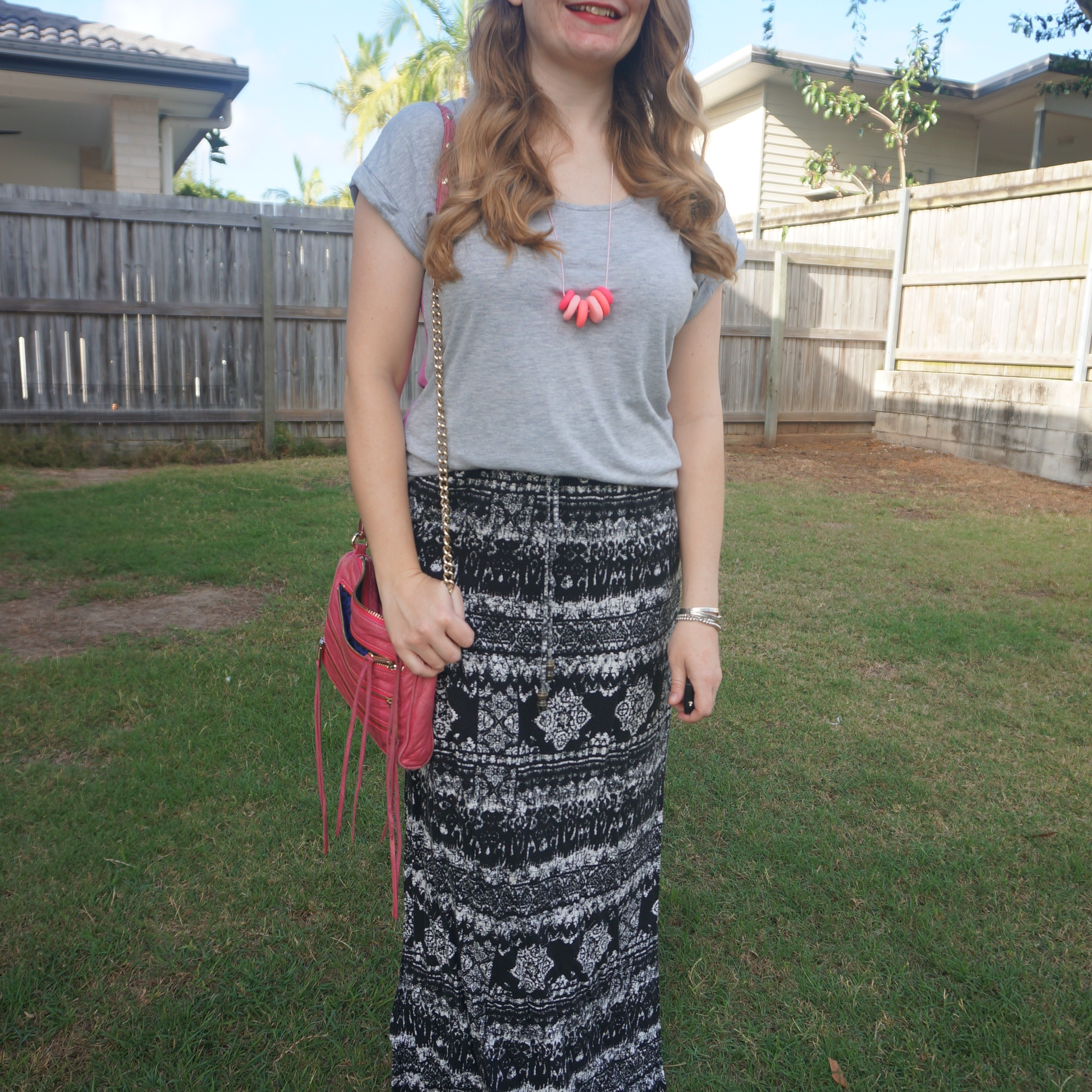 Grey tee and black and white maxi skirt with pops of pink from my accessories: handmade necklace and pink Rebecca Minkoff mini 5-zip bag 💕

#LTKaustralia #LTKspring