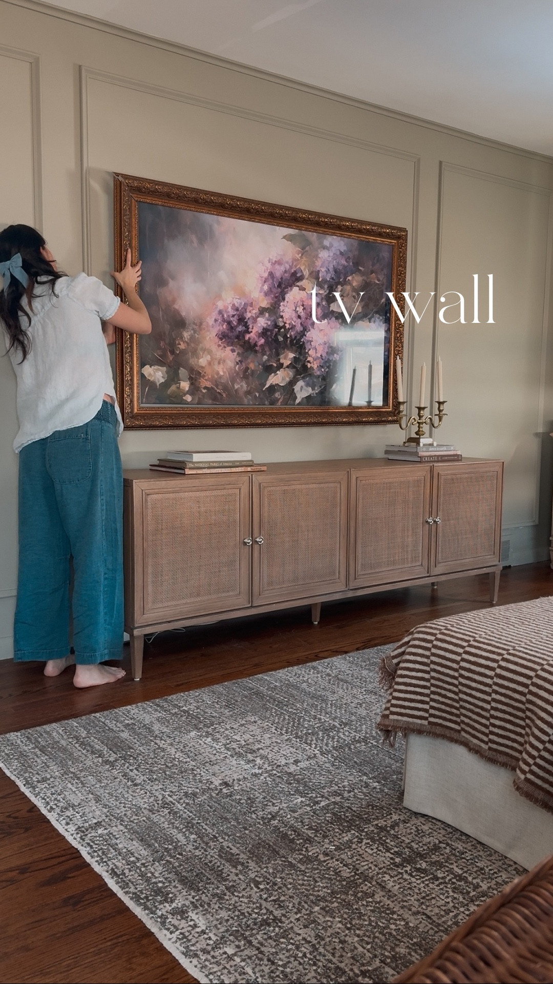 should I add art around the tv too or keep it like this? after installing the decorative moulding and painting in our living room I’ve been itching for more to bring this plain tv wall to life. I found this beautiful custom frame for my @samsung frame tv from an @etsy shop (which btw the shop owner was lovely) and the detail on it is just *chefs kiss* . Also added these curved wooden candle sconces on either side to set the mood 🕯️ 

#LTKSeasonal #LTKHome