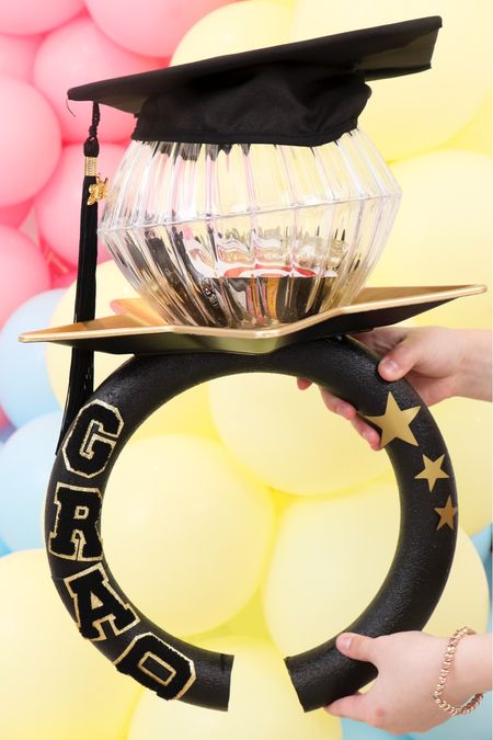 DIY Jumbo Ring Pop Gift – Graduation Edition 🎓💍#viralringpop but make it a for a graduate!
🎓
Fill this ring pop with grad gifts!, confetti poppers, cash, gift cards and more! Perfect for your little or big graduate. 🎓💍
BOWL & STAR PLATE from Dollar Treee
I’m working through a Ring Pop for every Season – A YEAR of Ring Pop Series (check out https://fernandmaple.com/diy-jumbo-ring-pop-gifts/ for Halloween, Christmas, Easter & More!)   💍 LIKE & FOLLOW for more fun Ring Pop gift ideas

#graduation #graduationparty #graduationpartyideas #graduationfavors #graduationday
#giantringpop #diycrafts #diytutorial #diyringpop #jumboringpop #viralringpop
 #dollartreediy #diydollartree #dollartreeringpop #lastdayofschool #diycrafts #diytutorial #endofschoolyear

#LTKGiftGuide #LTKSeasonal #LTKKids