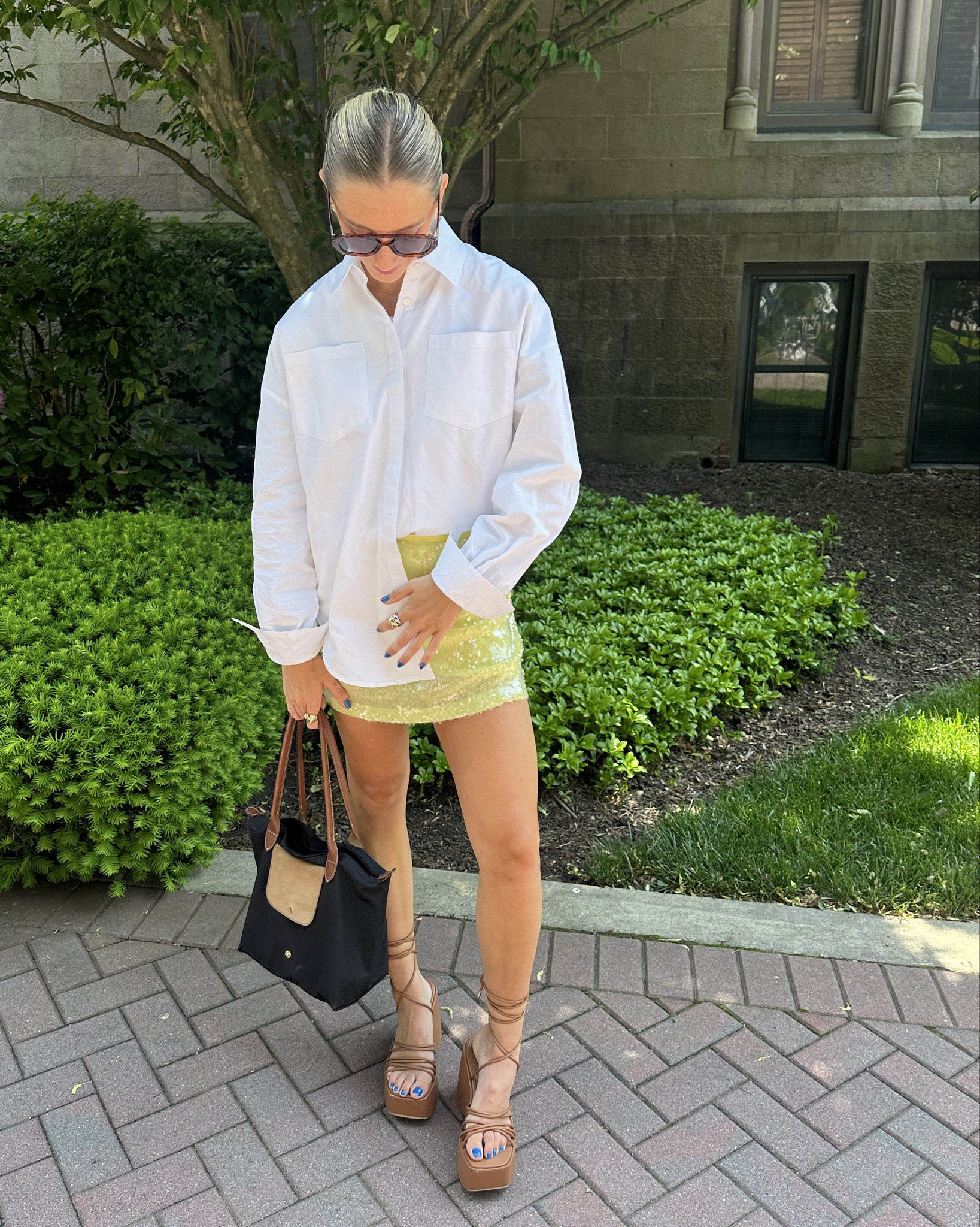White button down shirt with yellow sequin skirt and black longchamp purse 

#LTKstyletip #LTKGiftGuide #LTKSeasonal