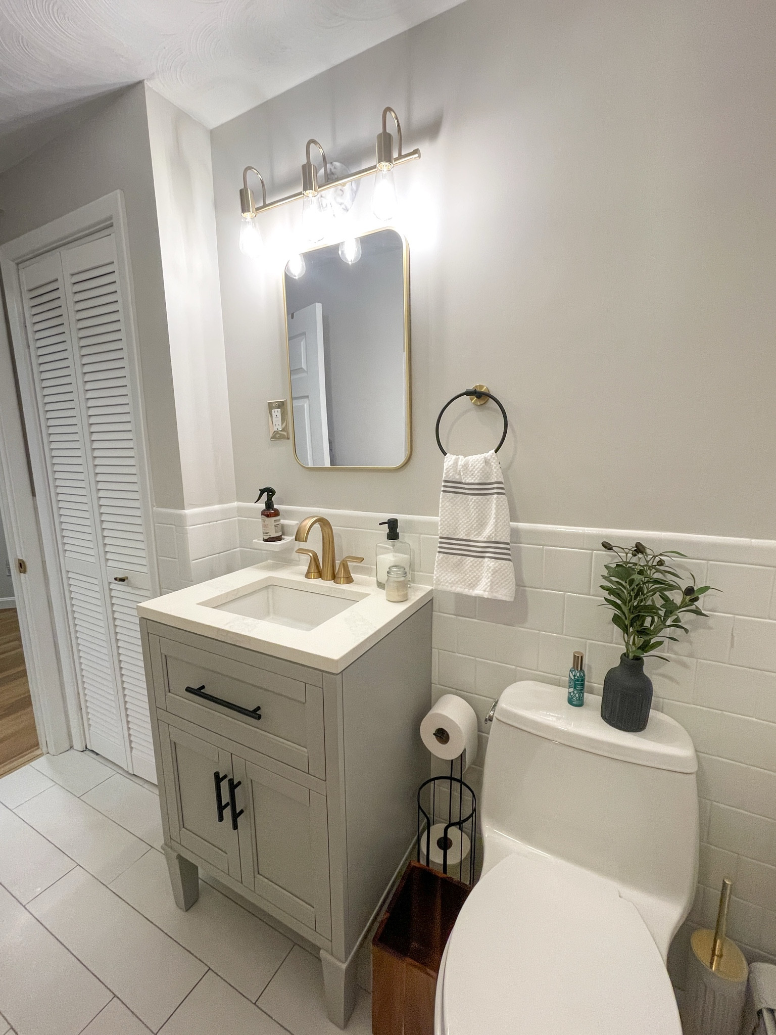 Guest bathroom is complete! I recently swapped out the light fixture with this new gold and marble one from Home Depot and added this wall mirror! 

#LTKHome