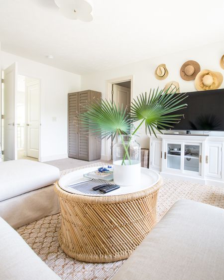 Love the summer vibes in the den of our last house! Items include a glass vase with a white painted bottom filled with faux palm branches, a slip-covered sectional, a bookcase with shutter-doors, a round bamboo coffee table, a jute area rug and a scalloped flush mount light. Items not shown include striped square poofs, several colors and patters of pillows, a tripod floor lamp and a round rattan mirror. simple decor, coastal decorating, living room decor, Walmart finds, target style, coastal design, den inspiration, coffee table decor, studio mcgee, square poofs, family room, living room area rug, family room decor, amazon finds, target finds, coastal inspiration #ltkfind #ltkfamily


#LTKSeasonal #LTKunder50 #LTKunder100 #LTKsalealert #LTKhome #LTKstyletip #LTKhome #LTKunder100 #LTKstyletip