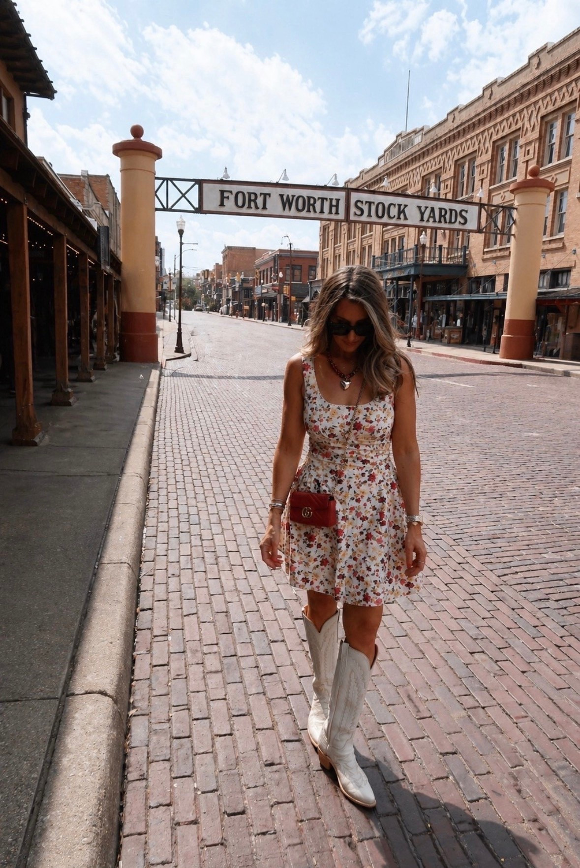 This floral dress and white cowboy boots combo is one of my favorite looks for a girls day in Fort Worth, country concerts, rodeos, or a fun date night. The feminine floral print paired with western boots gives it that perfect mix of sweet and southern, and the red bag adds the cutest pop of color. 

floral dress, western outfit, cowboy boots outfit, Fort Worth style, country concert outfit, rodeo outfit, girls night outfit, summer dress, western chic, Texas fashion, date night outfit, southern style, themominstyle

#LTKootd #LTKTravel #LTKOver40