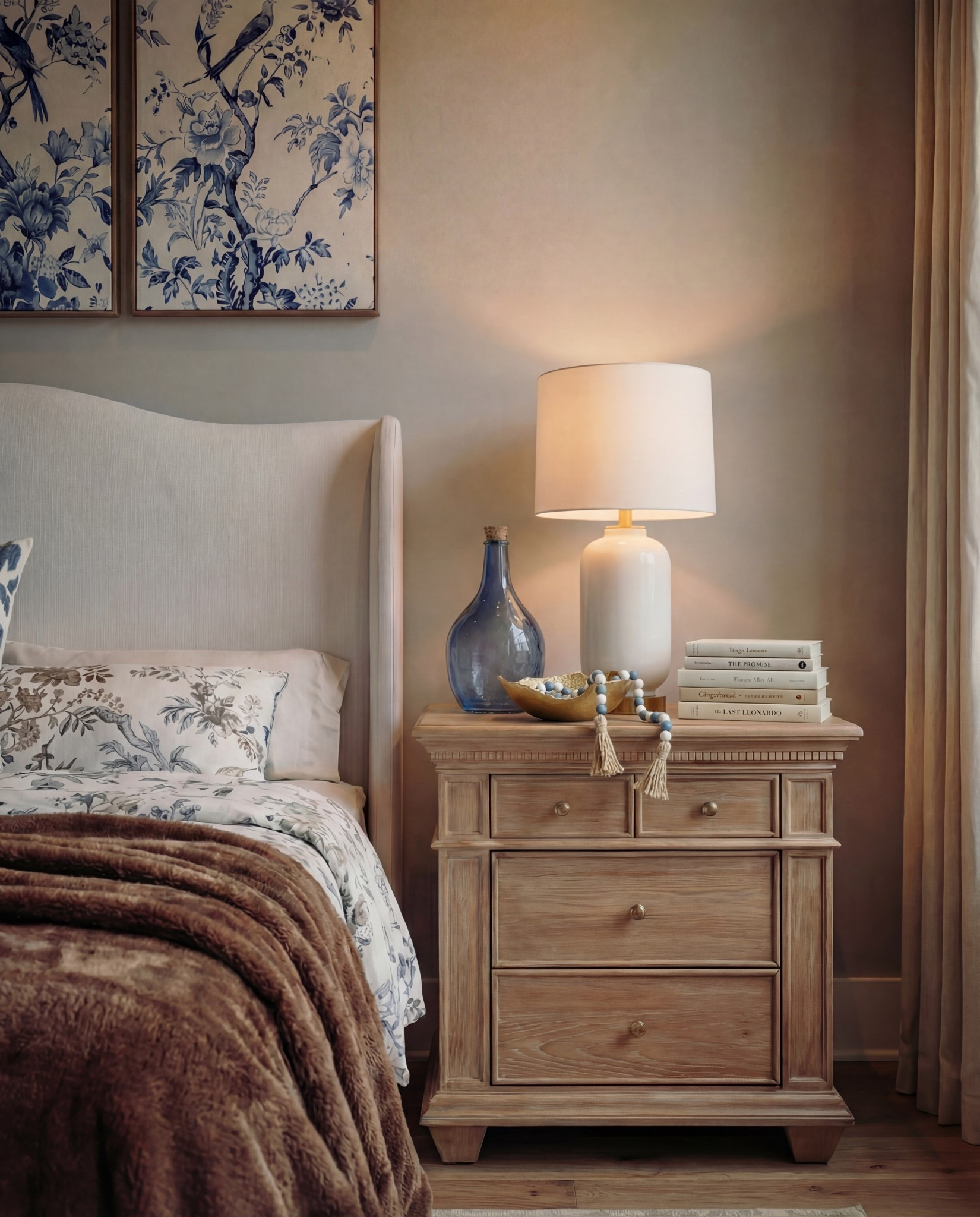 Shop the Look:
• Upholstered bed frame (soft ivory fabric)
• Neutral bedding set (white and light beige)
• Brown throw blanket (plush or wool)
• Blue and ivory accent pillow
• Wood nightstands with drawers (warm oak tone)
• Ceramic table lamps (white base, white shade)
• Blue glass decorative vases
• Framed blue-and-white botanical wall art (set of three)
• Upholstered bench with fluted wood base
• Traditional patterned area rug (beige, taupe, muted blue)
• Floor-length neutral curtains
• Wood ceiling beams (natural stained finish)
• Brass decor bowl all catch
• White and blue decor beads 

#LTKFindsUnder100 #LTKHome #LTKSaleAlert