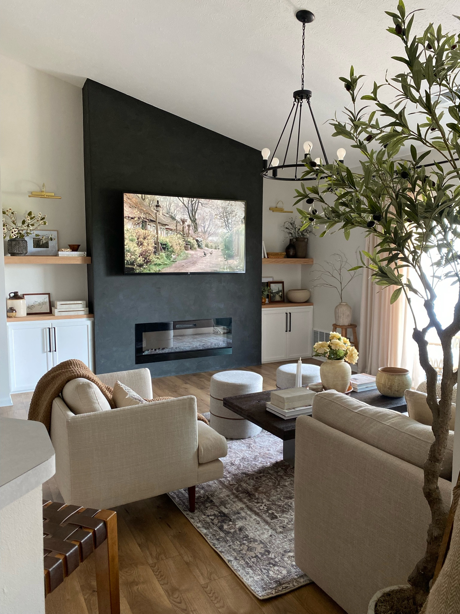 living room views featuring a cozy roman finish fireplace 

#ltkhome #ltk #ltksale