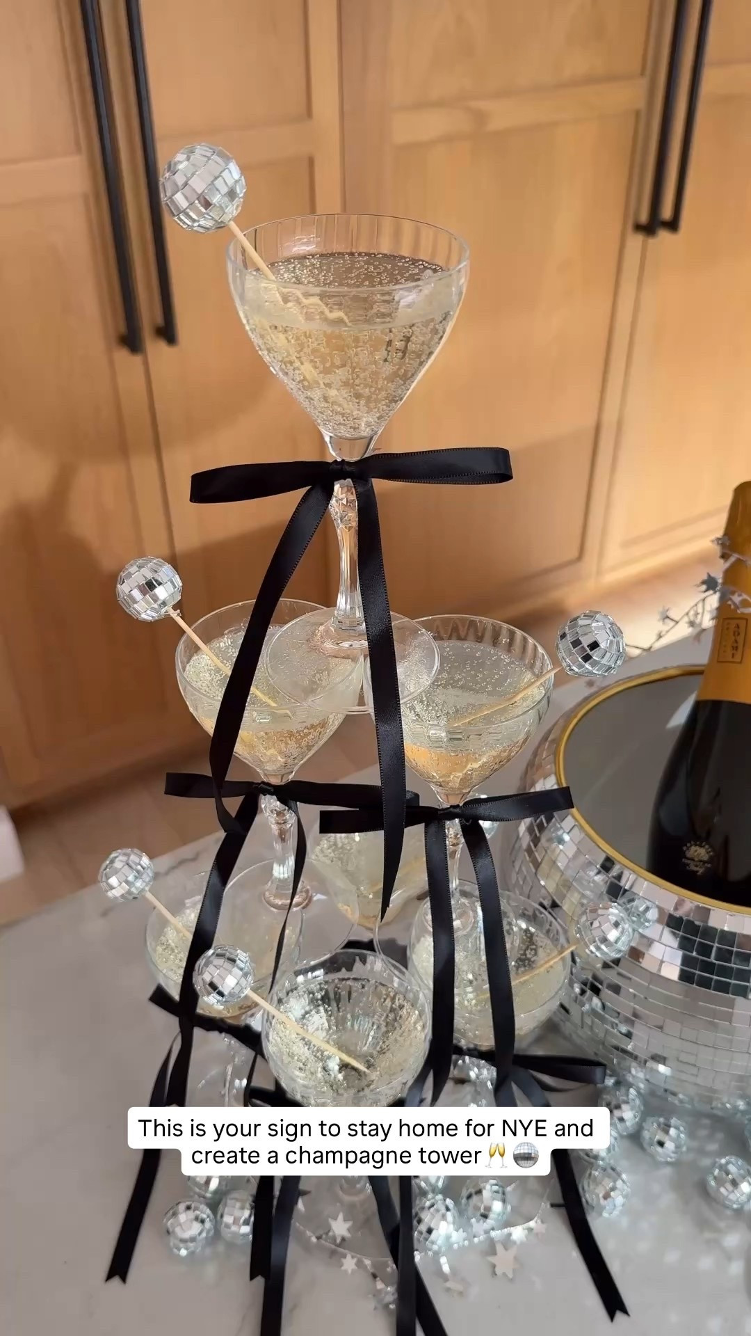 This is your sign to stay home for NYE at create a champagne towCham🪩 Grab your favorite coupe glasses and add a cute satin bow and disco ball pick - both from Amazon👏🏻 such a festive way to ring in the new year!!💫 2026, I’m ready for you🍾

#LTKHome #LTKFindsUnder50 #LTKHoliday