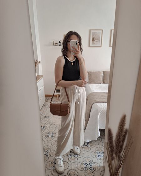 Comfy casual fit 🖤

- Tank top: wearing a medium
- Wide leg pants: wearing a large 
- Veja campo sneakers: run TTS

fashion inspo, summer outfit, summer ootd, casual outfit, casual ootd, casual chic outfit, casual chic ootd, tank top, black top, linen blend pants, wide leg pants, veja campo, white sneakers, style inspo, women fashion

