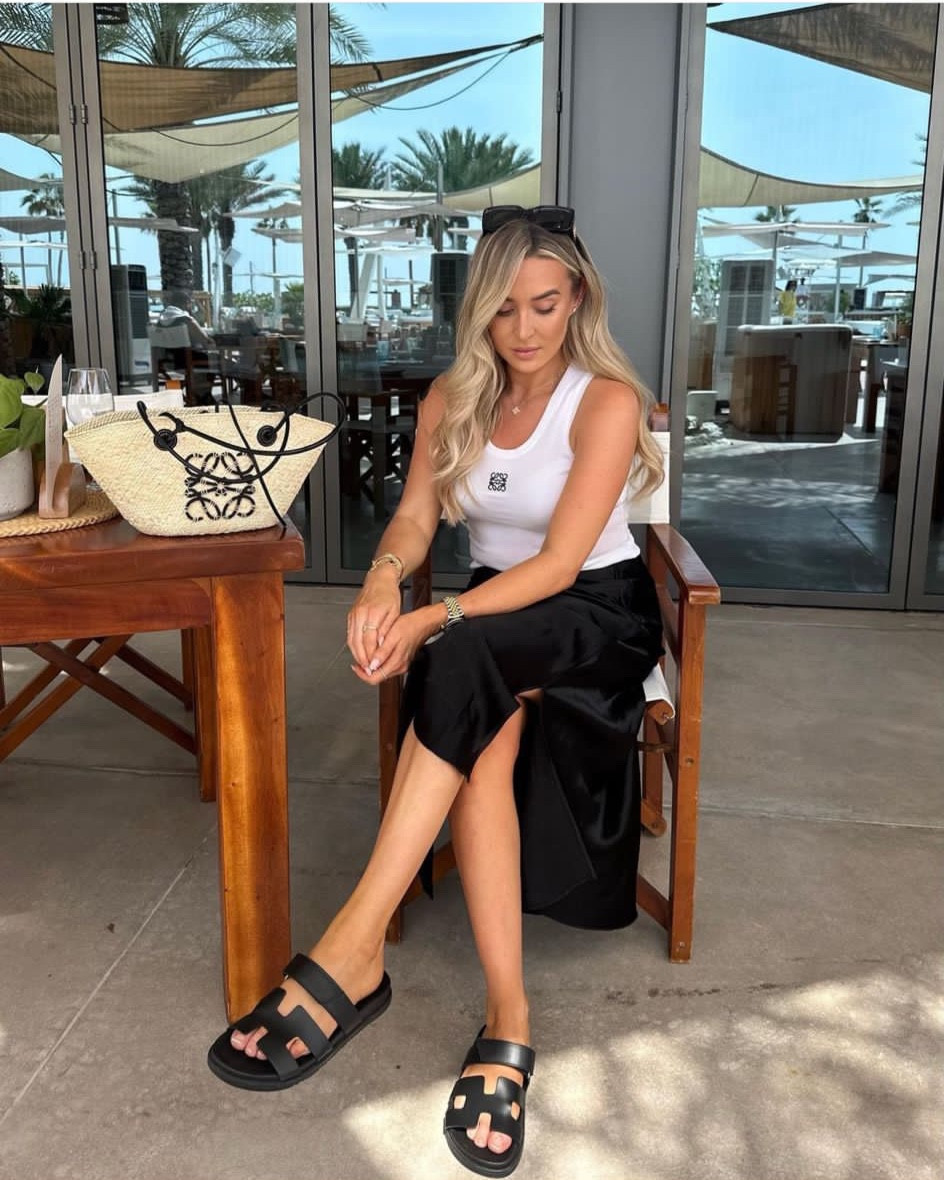 Simple day look for Dubai - arket black satin skirt, Loewe anagram vest top (dupe linked!), loewe basket bag and sunglasses & Hermes Chypre sandals 

#LTKtravel #LTKSeasonal #LTKstyletip