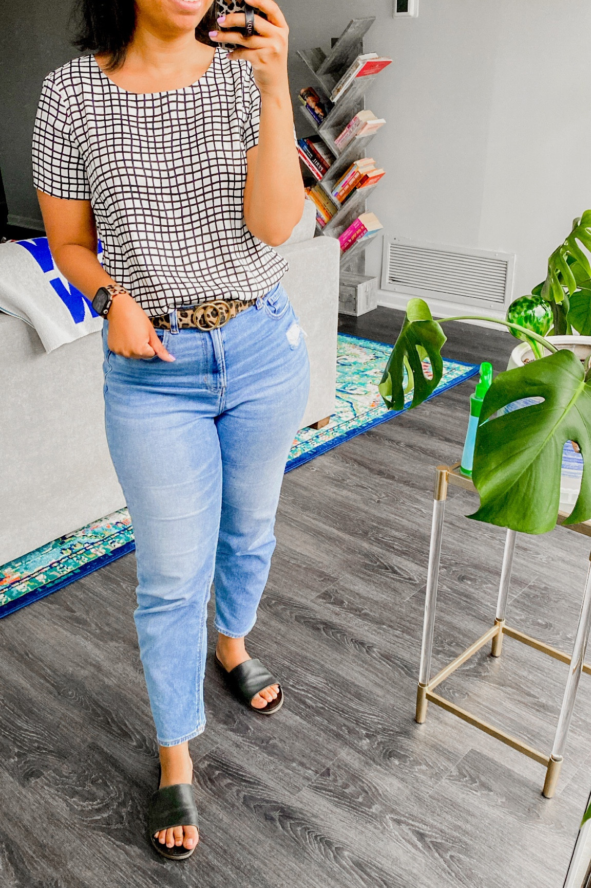 Cooler weather calls for jeans: here’s a look at what I’m wearing to work from home. Light rinse mom jeans, black leather slide sandals, windowpane blouse, work from home outfit, leopard belt, cute Apple Watch band

#LTKstyletip #LTKunder50 #LTKworkwear