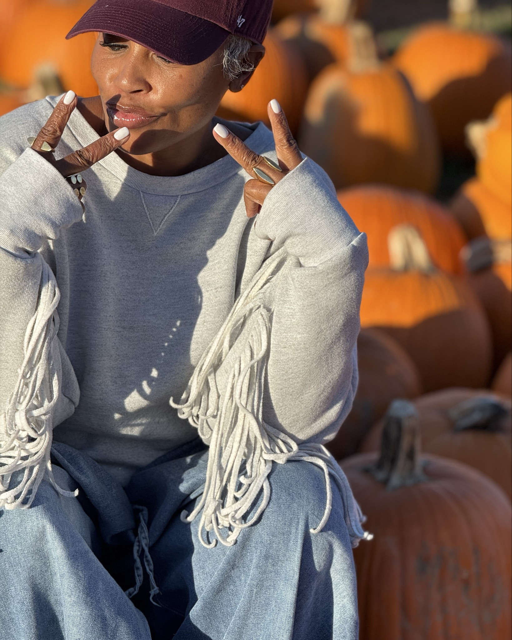 Posted up with the pumpkins 😜 

aaaand can we just zoom in on the this sweatshirt tho 🤌🏾✨

5’2 | 150 lbs | wearing size small 
#denim #falloutift #fringe #falltrends

#LTKSeasonal #LTKOver40