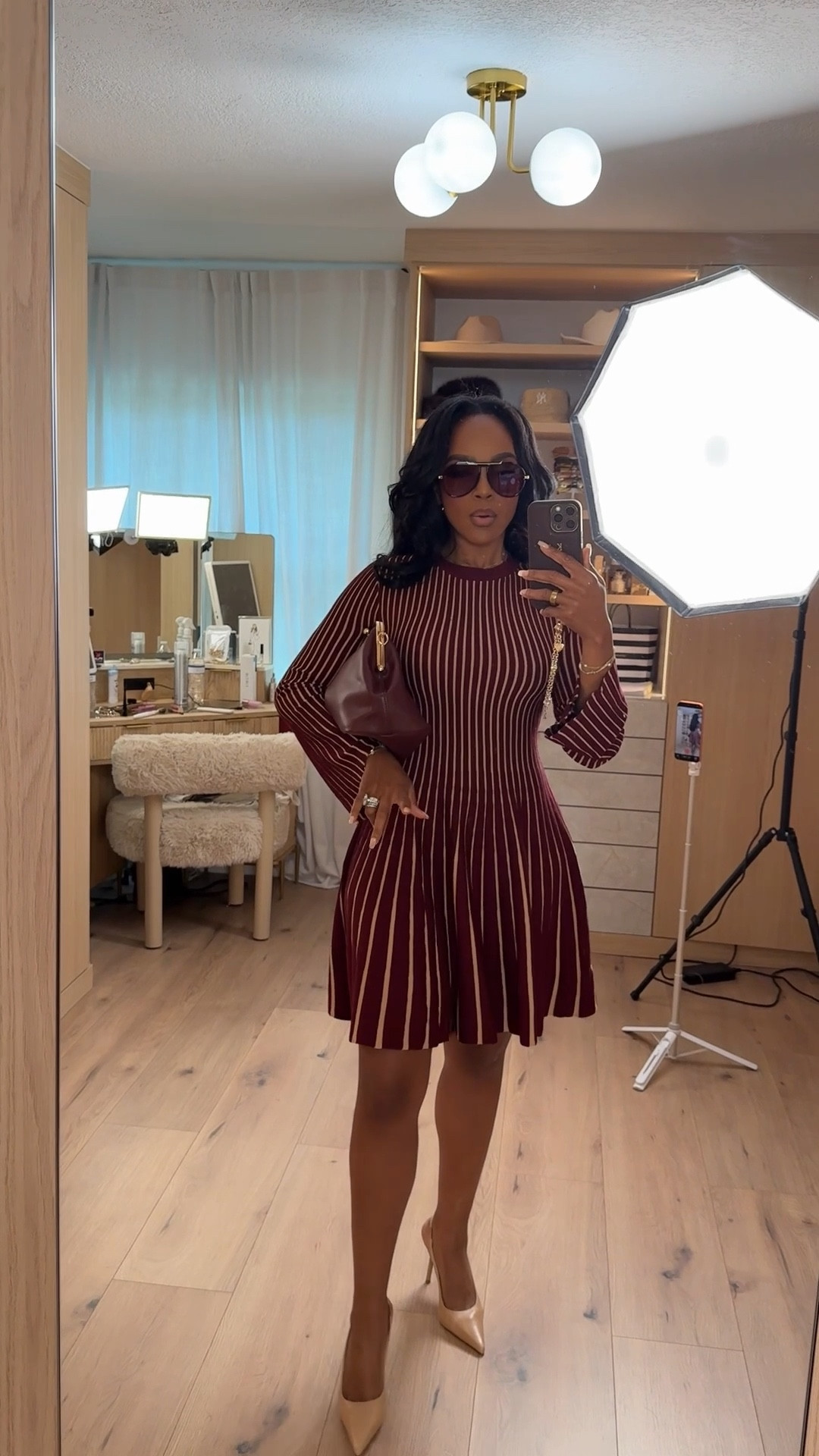 Burgundy moment, but make it polished ✨ This ribbed skater-style dress is one of those pieces that instantly elevates your look with zero effort. The vertical stripes cinch the waist while the flared skirt gives movement and shape — such a flattering combo.

Perfect for date night, dinner plans, holiday parties, or a chic girls’ night out.

📏 Sizing:
Wearing size Small  
Height: 5’4”  
Weight: 138 lbs  
Bust: 34D  
Waist: 27”  
Hips: 40”

This is one of those pieces you’ll reach for again and again — styled with heels, boots, or even layered with a coat, the cost per wear drops fast, making it a smart long-term shopping strategy.

Save this post for later if you love elevated, flattering dresses that work for multiple occasions.  
Keywords woven in naturally: ribbed knit dress, flattering skater dress, burgundy dress outfit, date night dress, fall winter dress styling, feminine everyday outfit ideas.

Follow me on Instagram and YouTube @kirasfashionfinds