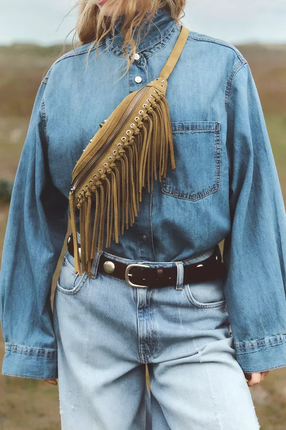 Suede fanny pack. Stud and grommet detail on the body. Adjustable crossbody strap. Interior zip p... | Zara US