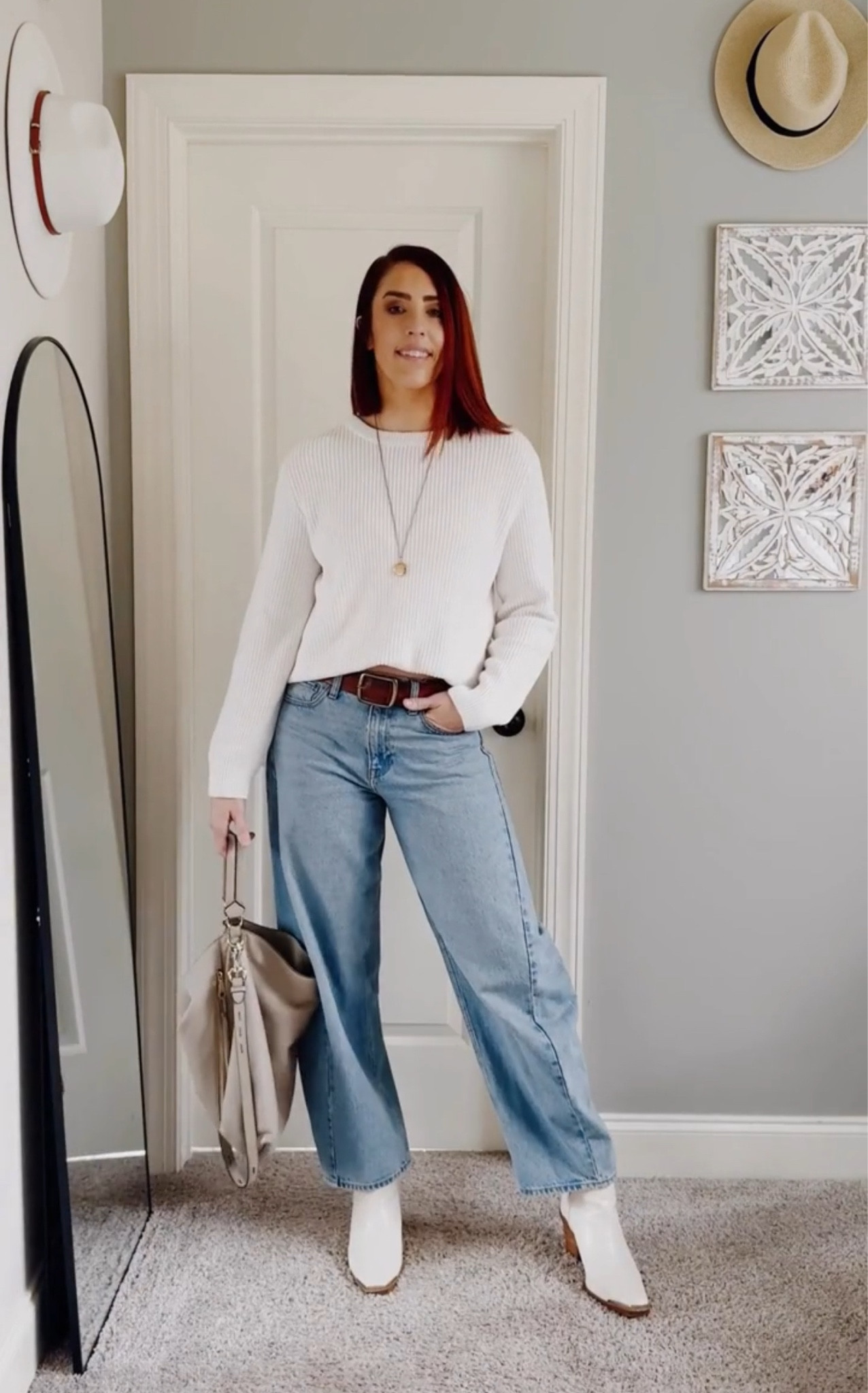 I kept it effortlessly cool with a white crew neck sweater (tucked just right for that cropped effect) and my go-to light wash barrel jeans—because when you’re tall, finding the right denim fit is basically a sport. A brown leather belt pulls everything together, while my white Western cut-out ankle booties add a little edge. The finishing touches? A beige hobo bag for that chic-but-practical vibe and a long gold locket necklace, because details matter.

#LTKStyleTip