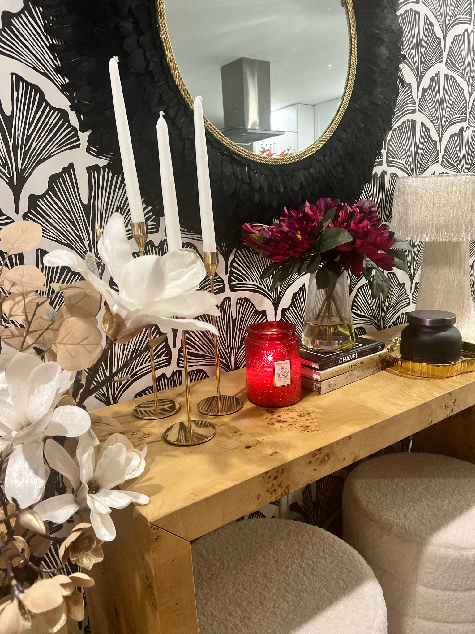 Entryway decor. Karl wood console table, tapered candle sticks, fringe lamp, black and white floral wall paper. 

#LTKhome #LTKfamily #LTKsalealert