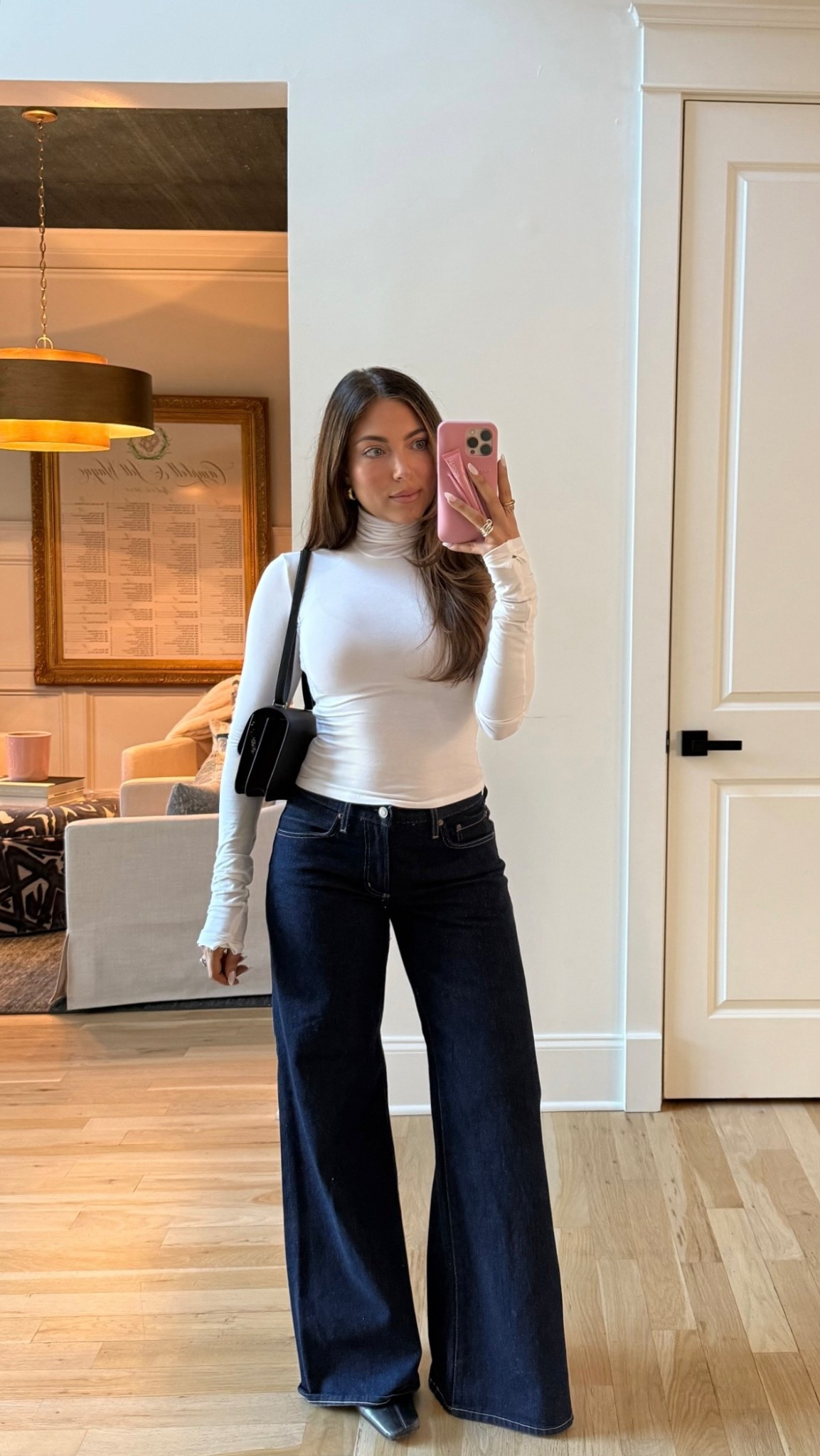 NBA game OOTD Helsa white turtleneck Agolde low rise baggy flare jeans