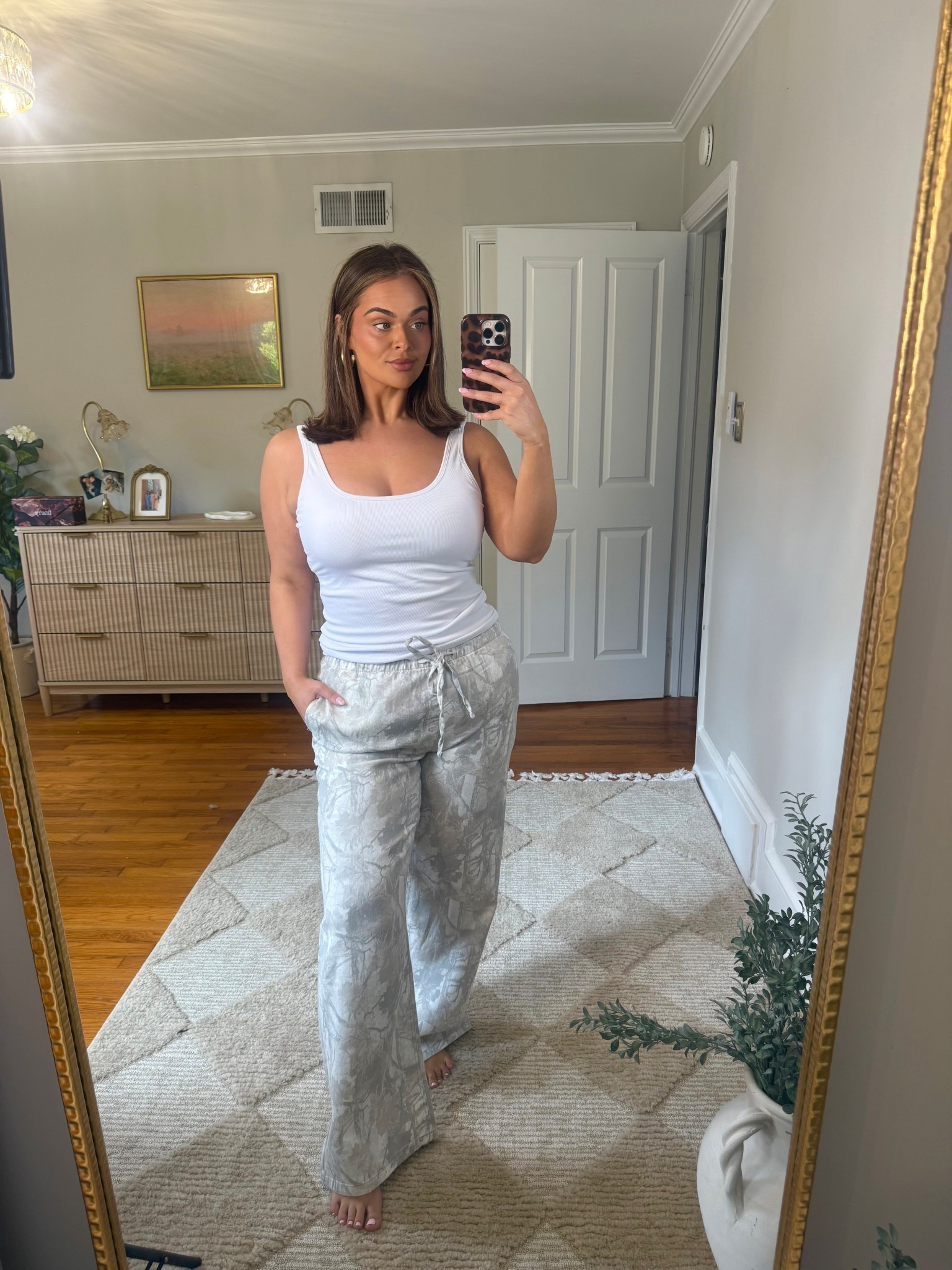 Camo linen pants for 60% off! I’m wearing a size a large. This tank top has a built-in bra/padding and I’m also wearing a size large in that!