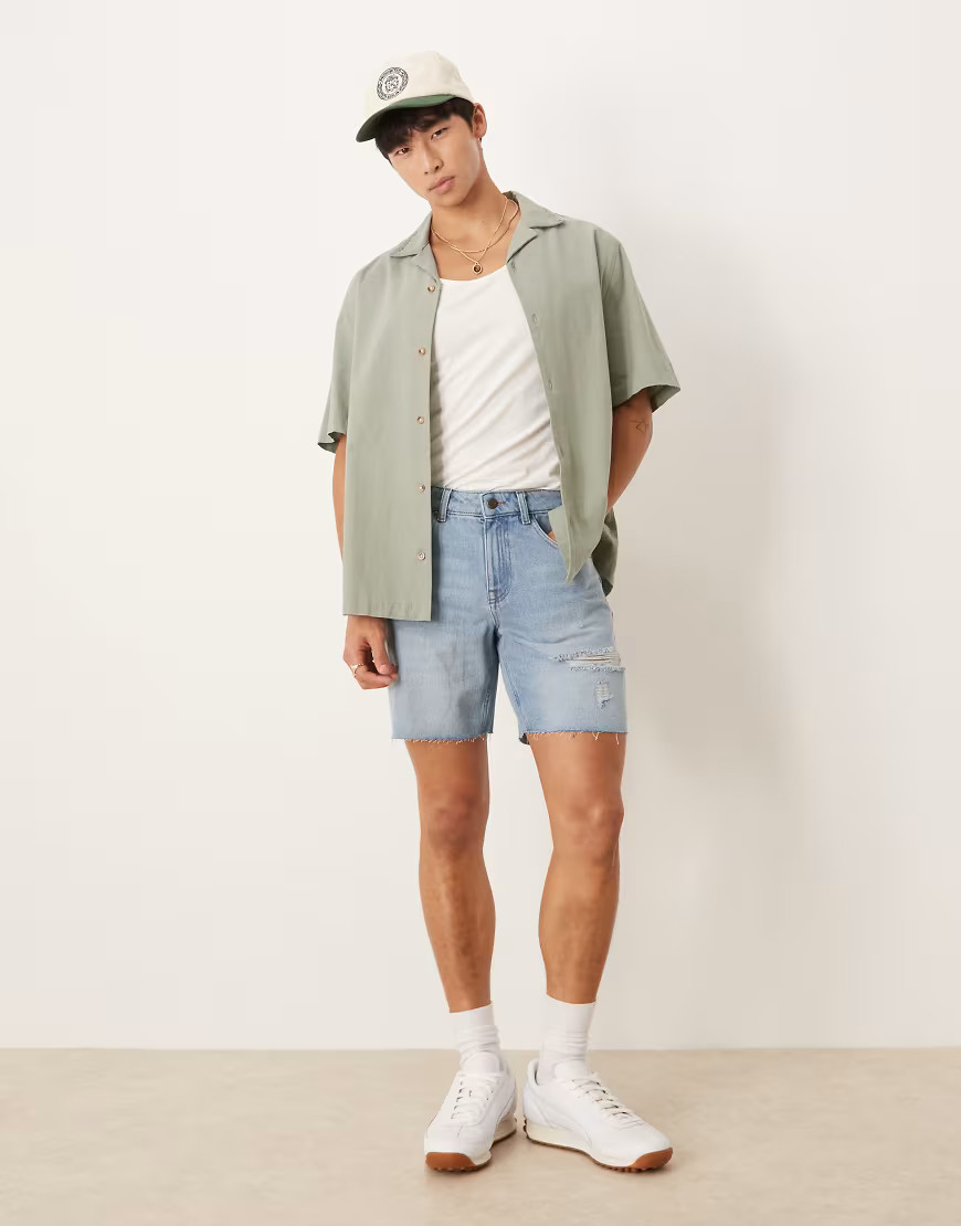 ASOS DESIGN mid length slim denim shorts with rips in light wash blue | ASOS (Global)