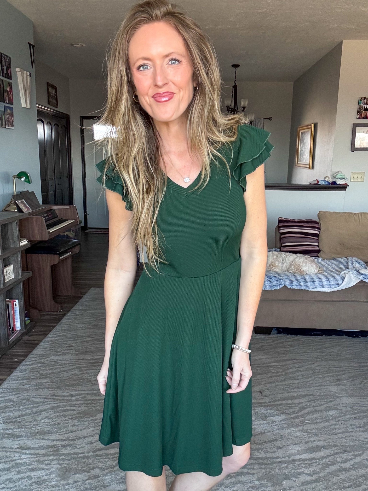 This deep green ribbed material dress is so good! 💚 Loving the double ruffle sleeves too! Wearing a small.

As an Amazon Influencer I earn commission on qualifying purchases.

Dark green knee length dress, green dress, St. Patrick’s Day outfit inspo, Spring outfit inspo 2026, mom style, wedding guest dress style 

#LTKOver40 #LTKBeauty #LTKMidsize