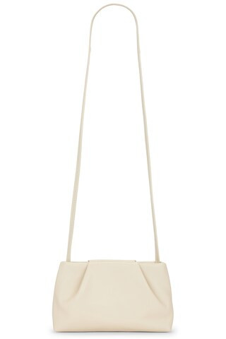 St. Agni Soft Tuck Sling Pouch Bag in Creme - Cream. Size all. | FWRD 