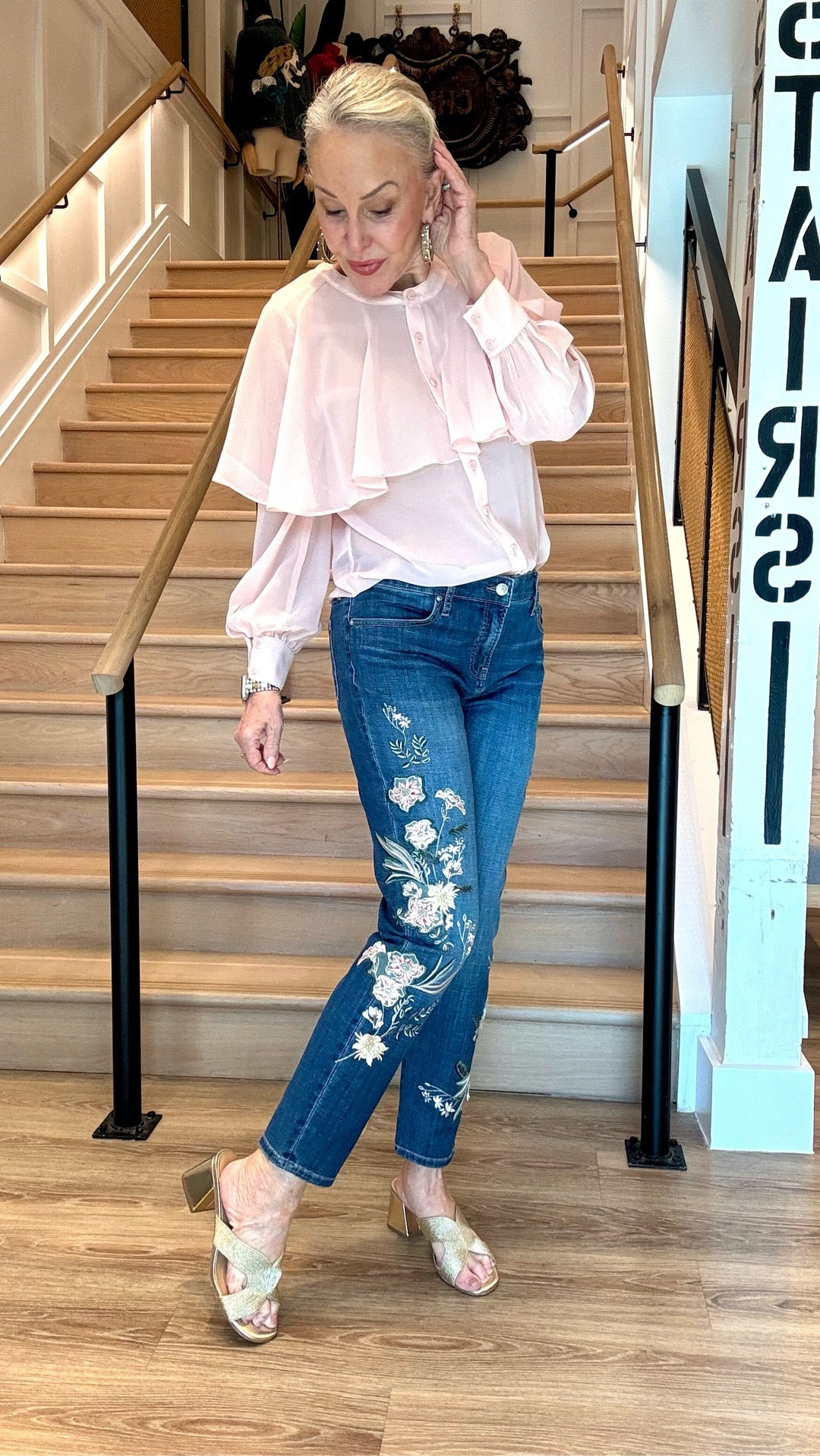 Chico’s sale Save $30 off $150 or $50 off $200+ in Bag 
Made with a medium wash denim showcasing floral appliqué patches. These jeans are cut for a slim silhouette and ankle length, featuring a fly front. Showcasing a tummy slimming interior that lifts and shapes your figure, courtesy of Chico's proprietary So Slimming® technology. 
Rise sits just below the natural waist. Slim-leg ankle jean
Regular: 28", Tall: 31".
92% Cotton, 6% Polyester, 2% LYCRA® Spandex.
I wear a size 0 in Chico’s unique sizing.
Georgette cape blouse
Large gold hoop earrings 
Gold slide sandals 

#LTKFindsUnder100 #LTKSaleAlert #LTKOver40