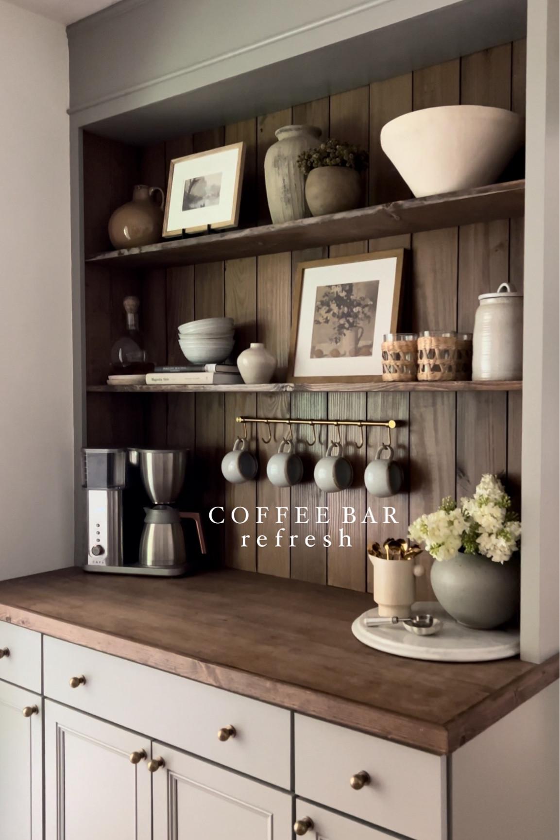 Coffee Bar Refresh | coffee bar styling | pitcher | coffee spoons | vase | faux lilacs | afloral | Amazon finds | creative co-op | Target finds | hearth and hand | trinket dish | cafe coffee maker | Michael’s gallery frames | picture stand | seagrass tumbler | vintage art | mug rack | mugs | knobs 

#LTKFindsUnder50 #LTKHome #LTKFindsUnder100