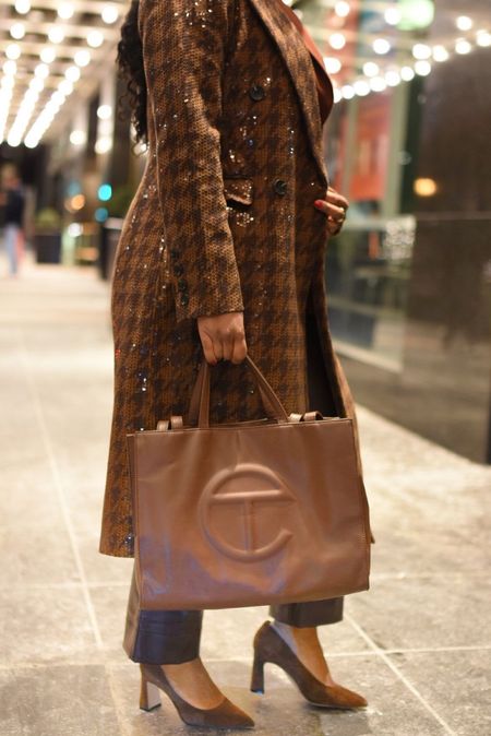 Telfar bag
Sequin coat
Brown suede pumps 