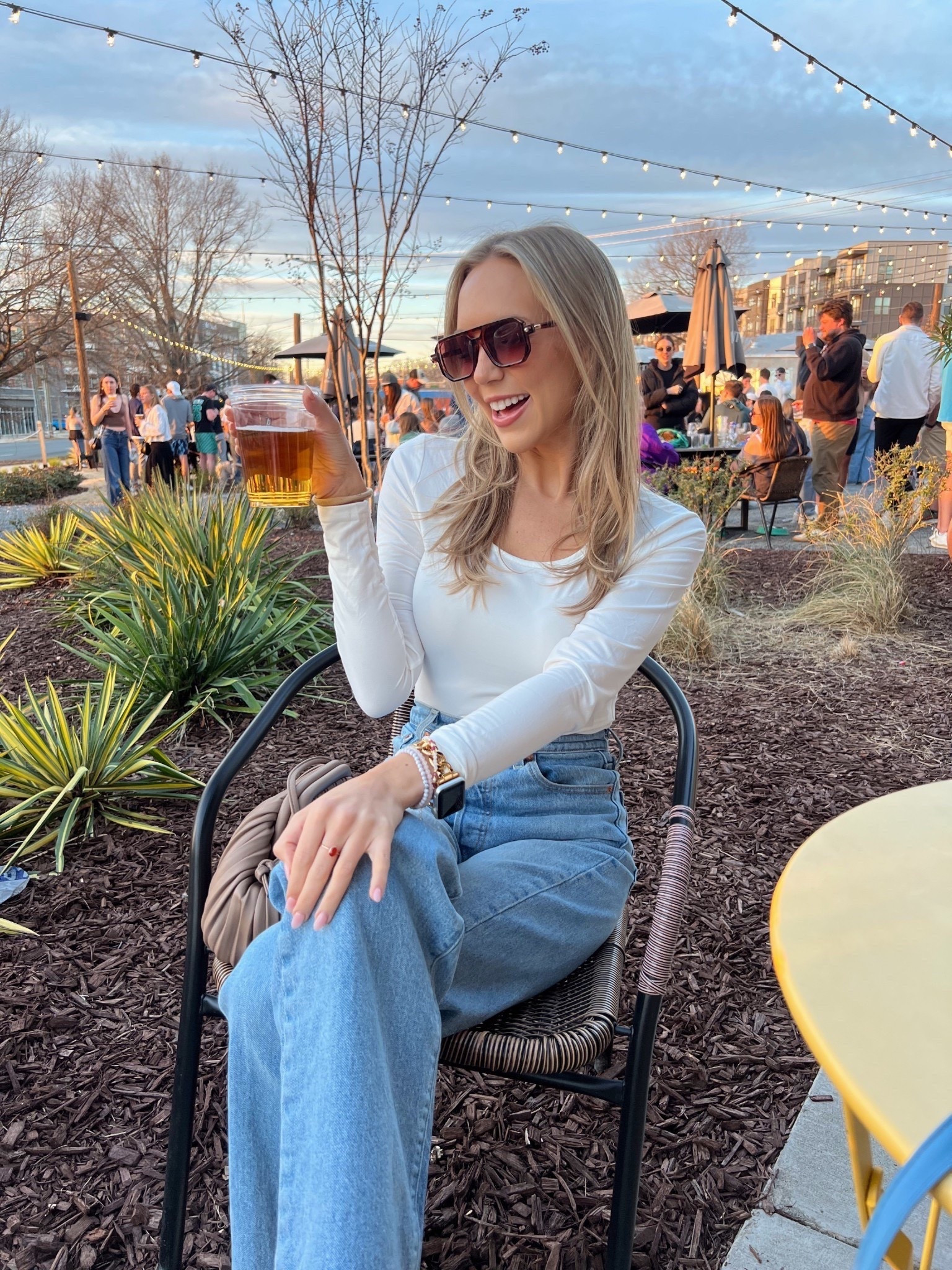 White long sleeve crop top, Levi straight leg jeans, sunglasses and taupe bag outfit 

#LTKFindsUnder50 #LTKFindsUnder100