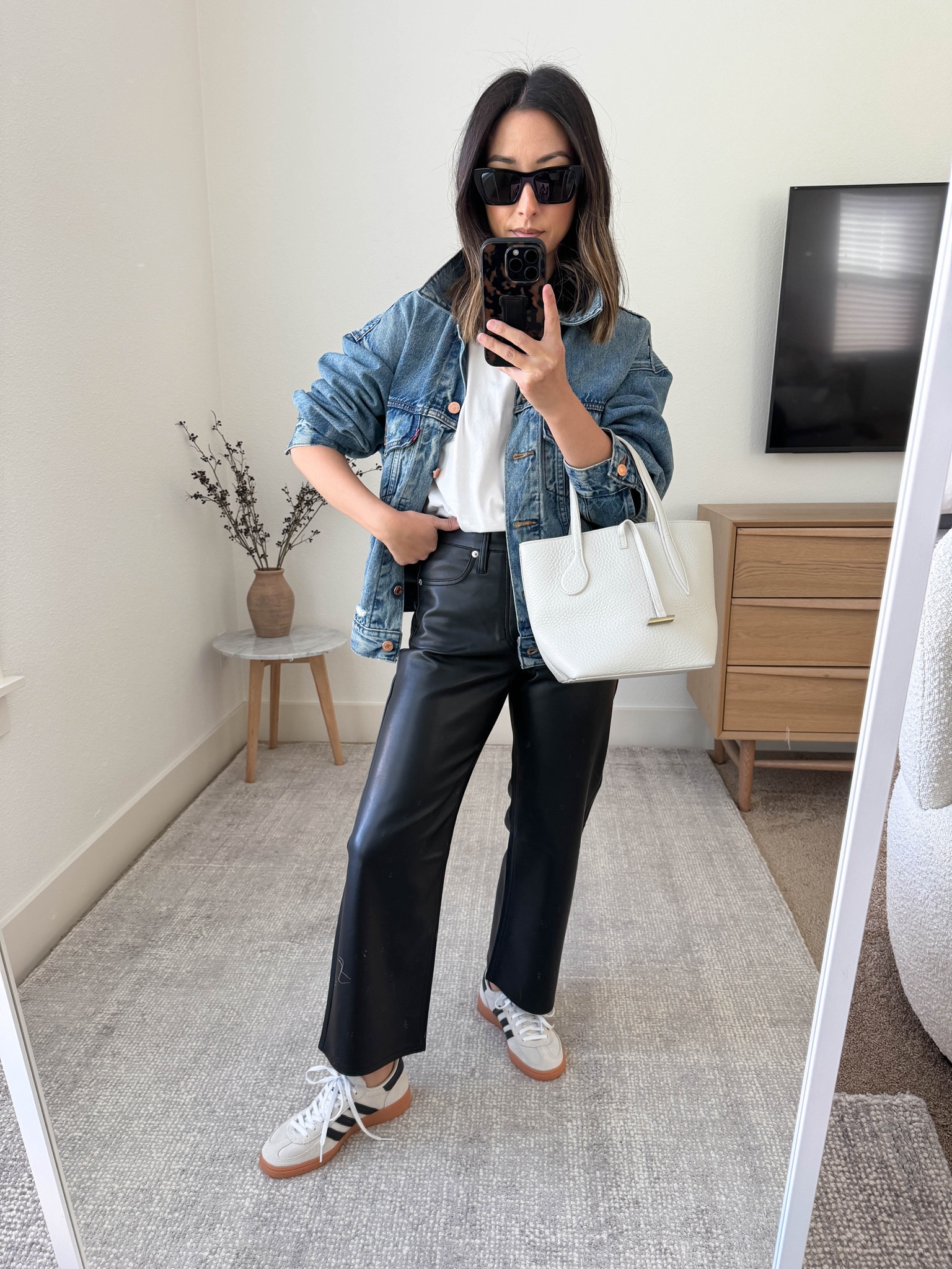 J.crew slim wide legged faux leather pants. They’re butter soft and so comfy. I sized up for a roomy fit. 

Levi’s denim jacket xs
Everlane tee medium
J.crew pants petite 25
Adidas Spezial 4 men’s. 
Little Liffner bag 
YSL sunglasses  

#LTKSeasonal #LTKshoecrush #LTKitbag