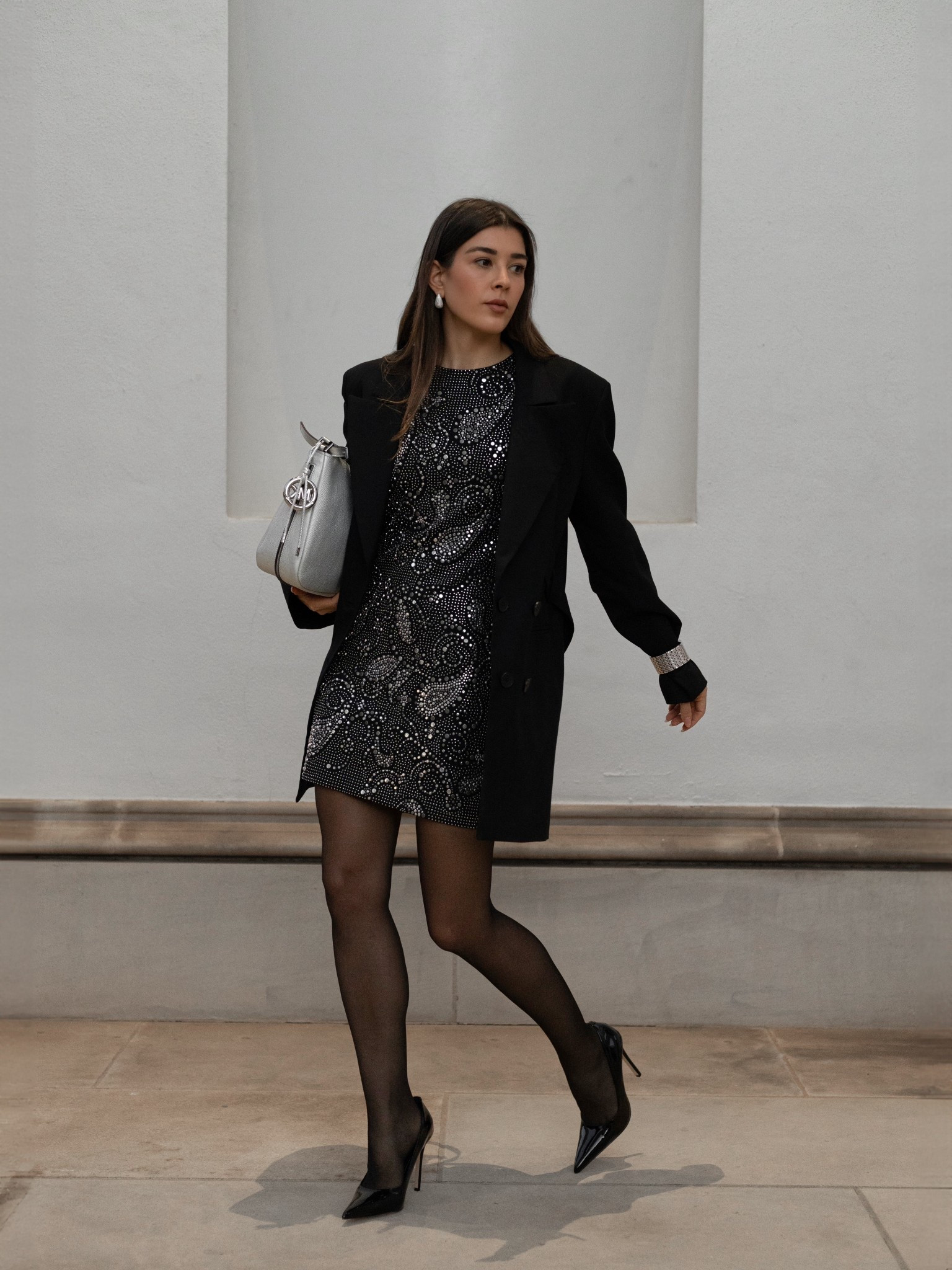 Holiday Party uniform! Sparkly studded mini dress, black blazer and pointed black pumps. A timeless look that perfectly mixes classic with fun holiday shine. The silver and diamond statement watch over the sleeve is the perfect touch of edge. A minimal yet vibrant holiday look that is sure to make an entrance! 

#LTKootd #LTKHoliday #LTKParties