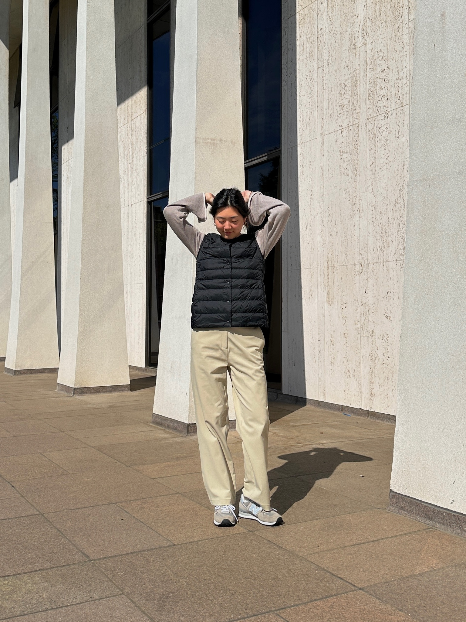 east coast style neutral outfit with black sleeveless vest and beige trousers and new balance sneakers

#LTKshoecrush #LTKstyletip #LTKfit