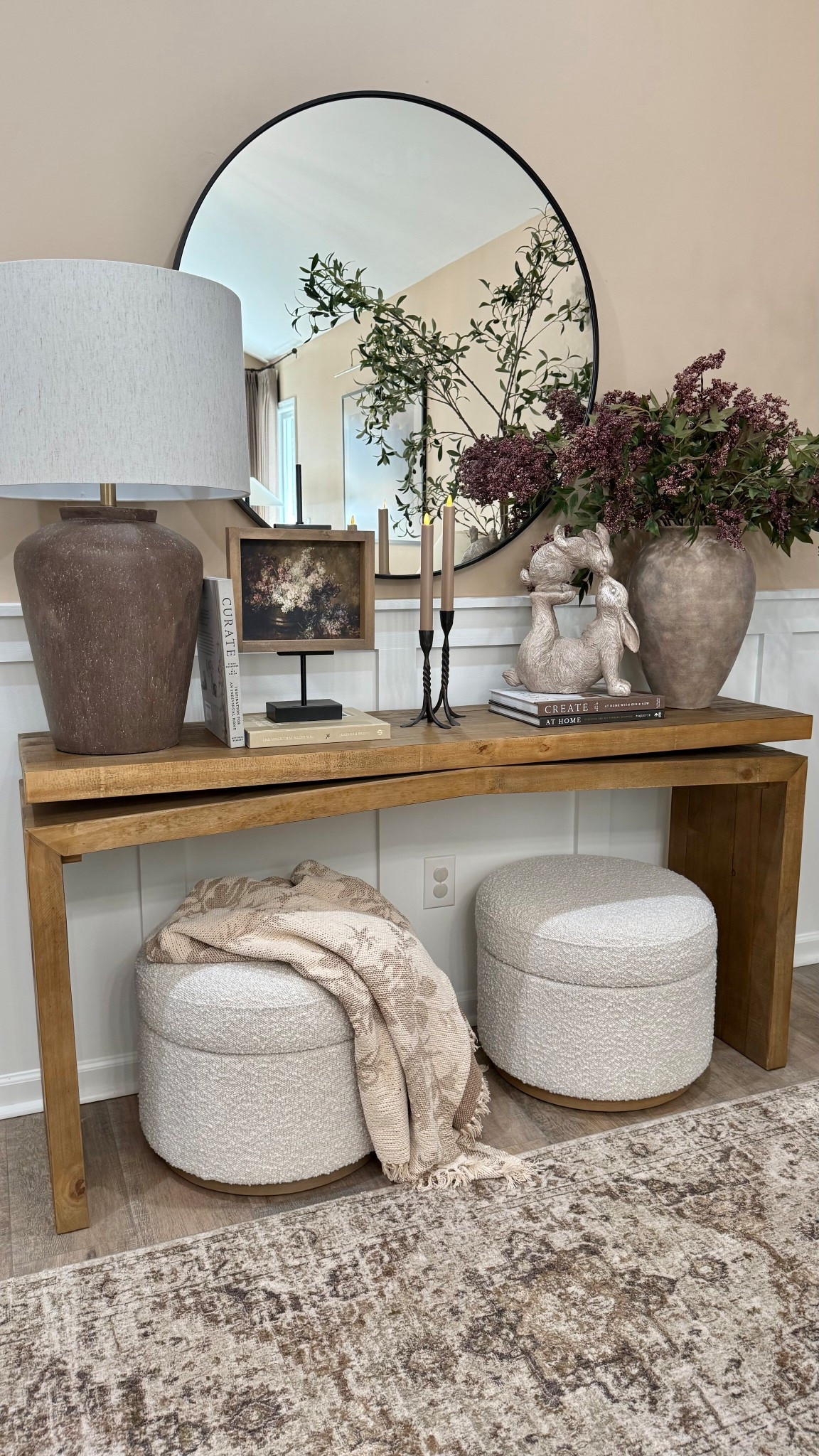 Spring Console. Follow @farmtotablecreations on Instagram for more cozy home inspiration and styling ideas.

These berry stems are one of my favorite ways to add a simple seasonal touch while keeping everything warm and neutral. I paired them with stacked books, candlesticks, adorable kissing bunnies, and this beautiful 7x9 artwork from Brittany @currentlychic in the Briarsmoke stained frame for a layered, cozy look.

Use code FARMTOTABLE to save 15% off the artwork.

#consoletable #entrywaydecor #entrywaytable #tablelamp #homedecor #berrystem #decorativevase #ottoman #arearug



#LTKSaleAlert #LTKHome #LTKSeasonal