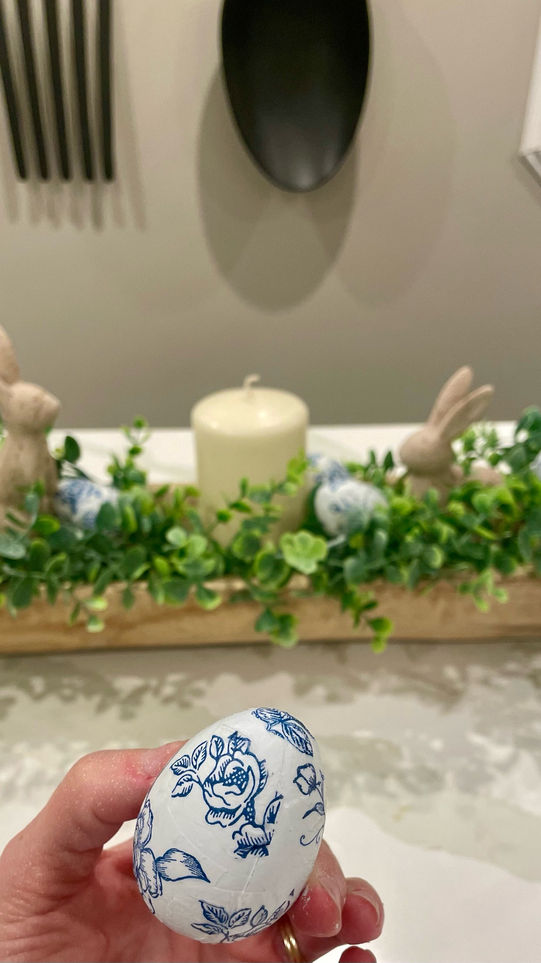 Create stunning chinoiserie decoupage Easter eggs by applying blue and white patterned napkins to wooden or plastic eggs using Mod Podge. Use white eggs or paint eggs white first, apply torn napkin pieces with Mod Podge, smooth them, and seal with a top coat. These elegant, handmade eggs are perfect for bowls, trees, or spring decor.
