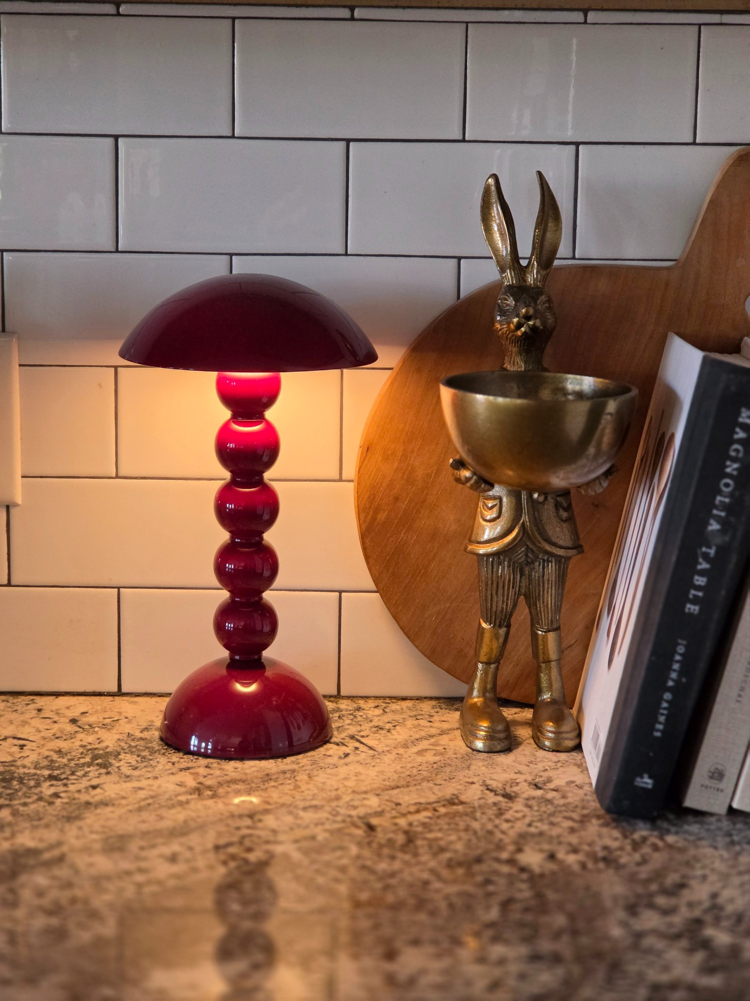 The love of a rechargeable lamp. The brass bunny gives some vintage vibes while the bobbin lamp is more modern. I added cookbooks and a wood cutting board that I actually use. I give you functional decor. 

#LTKstorytime #LTKHome #LTKOver40