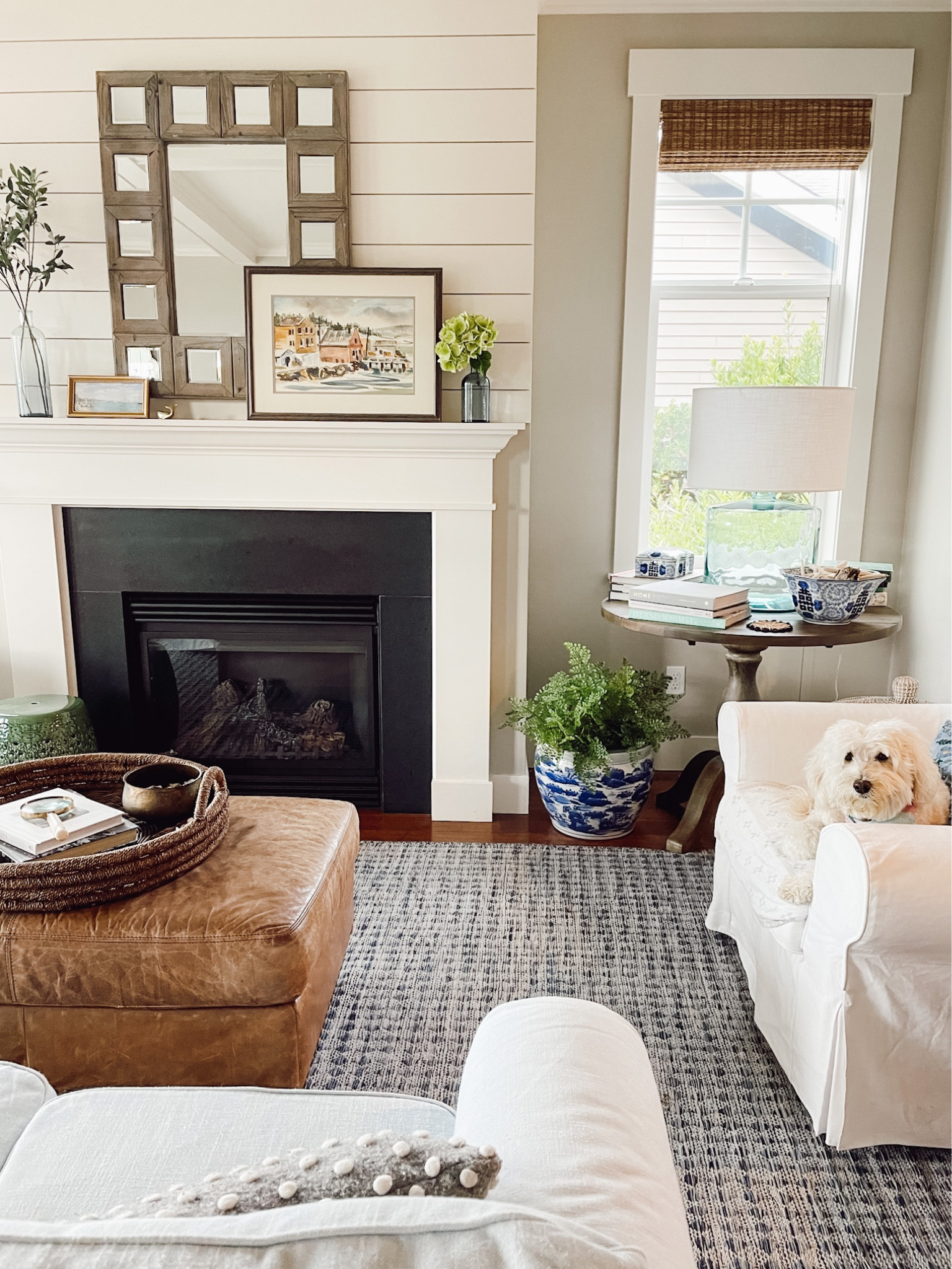 Fall living room - Blue glass lamp, blue and white indoor outdoor rug, white slipcover for ikea ektorp chair, similar leather ottoman 

#LTKSeasonal #LTKhome #LTKunder100