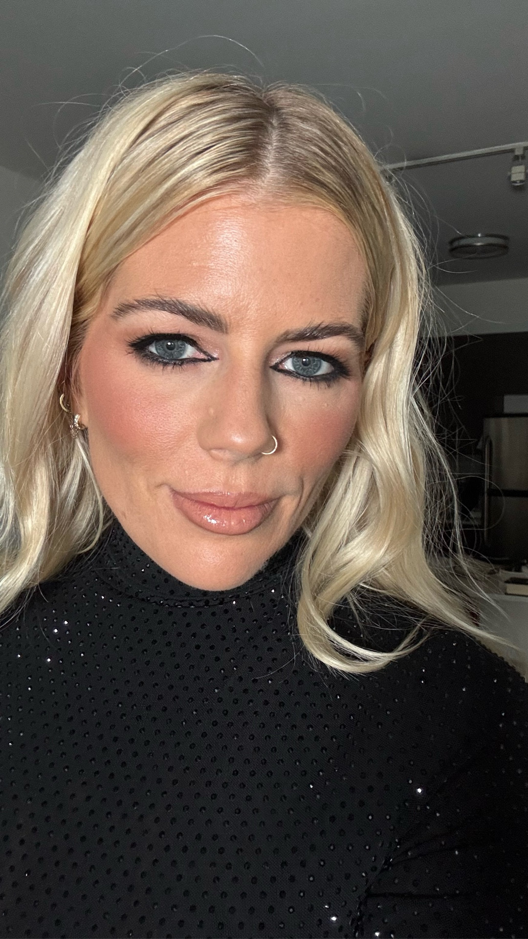 New Year’s Eve glam! Smokey eye and an over lined nude lip! 