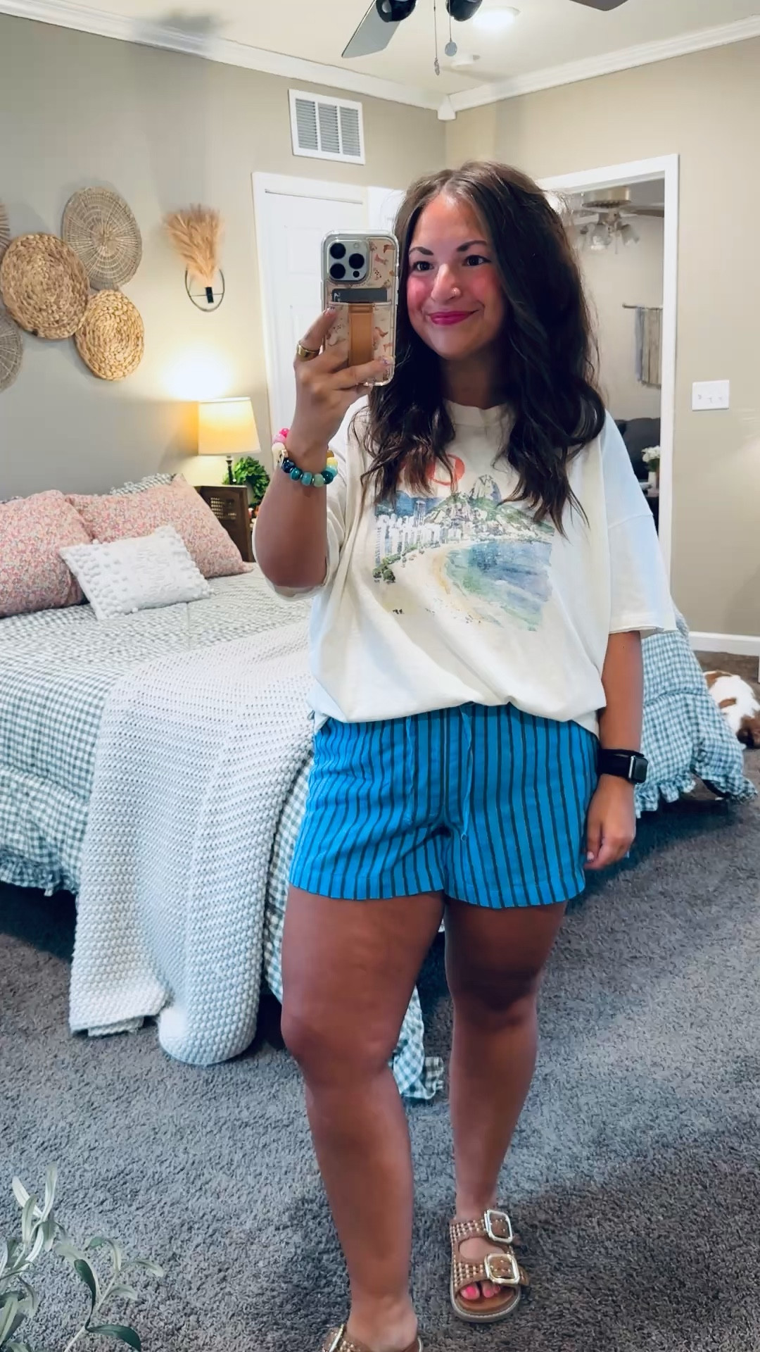 Trending for a reason 🤍 Graphic tees and striped shorts are the ultimate casual summer combo—laid-back, cute, and perfect for all your warm-weather plans ☀️

sandals: fit true to size // wearing a 5
shorts: fit true to size // wearing a medium
tee: fits oversized // wearing a medium 

 #LTKootd #LTKMidsize
