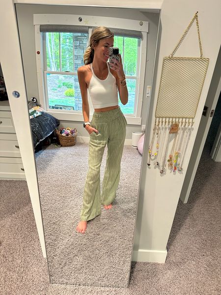 Beachy summer style and outfit ideas
Amazon TikTok Viral tank tops are a must this spring and summer perfect for layering 
Casual outfits with wide leg pants 
Green striped pants 