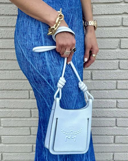 This stunning @mcmworldwide Baby Blue Himmel Hobo in Embossed Logo Leather is the perfect Summer accessory that will elevate any look🩵 & is almost $300 off rn too! 

Handmade to perfection from the iconic luxury brand, the Himmel Hobo is a testament to unparalleled craftsmanship and superior quality. 

From the luxurious natural leather material to the impeccable stitching and classic MCM emblem imprinted on the front, this purse truly is a masterpiece. 

Available in four beautiful color ways, this timeless bag will always elevate your accessory game. Use the code ‘MCMSTREETSTYLESQUAD’ to receive 10% off of your MCM purchase. 

Curious about my Summer-ready bag essentials?   Take a peek inside my daily must-haves: First up, my go-to makeup essentials, the Hourglass lip gloss in Canvas, Fenty lip gloss in Fantasy & Fussy, NYX lip liner in Sand Beige, and Terry Hyaluronic pressed powder. But it doesn’t stop there - I always have my Lumify Redness Reliever Drops and L’occitane Dry Skin Hand Cream as well. And of course, no bag of mine is complete without my card holder from The Setai Hotel in Miami. 

Make this stunning bag yours by clicking at the #linkinbio 

SHOP THESE PRODUCTS:
1. shop my looks by following @streetstylesquad on the @shop.ltk app
2. just place this link in your browser: https://liketk.it/4FyKe
3. clicking the #linkinbio 
4. just dm me
5. or by clicking links in my stories
 #ltkstyletip #ltkitbag #mcm #MCMMothersDay #mcmhandbag #liketkit 


#LTKItBag #LTKStyleTip #LTKVideo