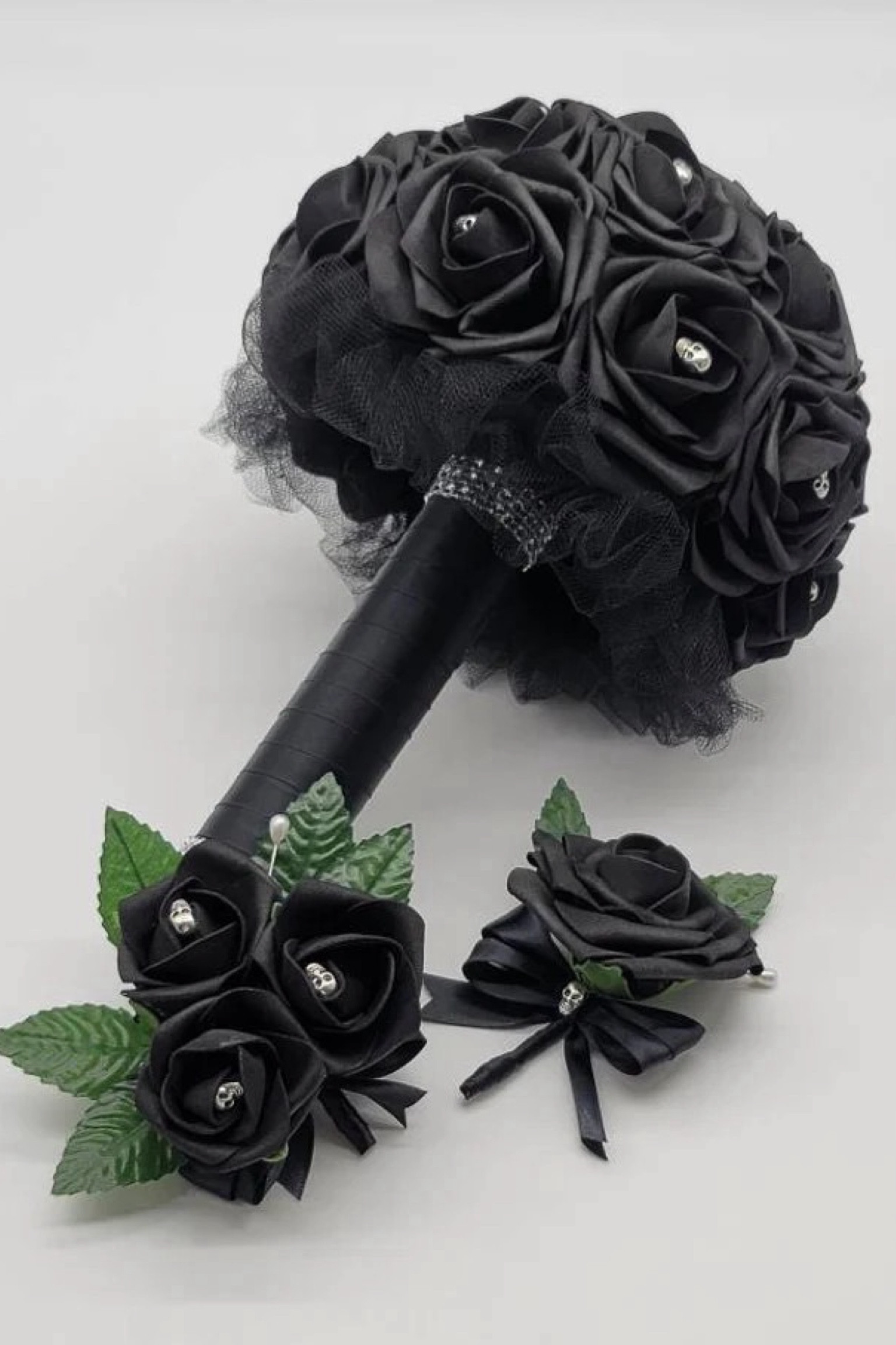 For a bold and unforgettable bridal look, this custom-made Gothic skull bouquet from DreamsicalCreations is a showstopper! Crafted with real-touch black roses, each adorned with a skull, this bouquet is perfect for a gothic or Halloween-themed wedding. The handle is wrapped in luxurious black satin ribbon and tulle, with customizable accessories for a truly personal touch. #GothicWedding #SkullBouquet #BlackWeddingBouquet #HalloweenWedding #DreamsicalCreations #UniqueBridalBouquet #GothicElegance #CustomBouquet #DarkRomance #WeddingFlorals

#LTKWedding #LTKSeasonal #LTKHalloween
