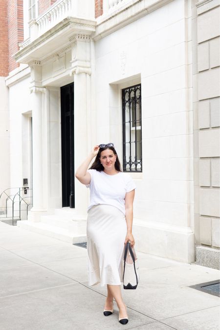 Summer in the city! 🤍☀️ @jcrew 

Wearing a size Large in J. Crew tee and J. Crew satin midi skirt. Chanel heels and black handbag. 

Midsize blogger || Upper East Side

#summerstyle #summerfashion #injcrew #jcrewstyle #midsize #midsizestyle #midsizefashion #midsizeblogger #nycblogger #nycstyle #nycstylist #nycstyleblogger #size12style #minimaliststyle

#LTKcurves #LTKstyletip #LTKunder100