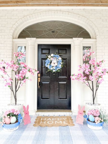 Easter porch spring porch cherry blossom trees scallop basket Easter basket bunny eggs blue gingham outdoor rug hydrangea wreath 

#LTKSeasonal #LTKSpringSale #LTKhome