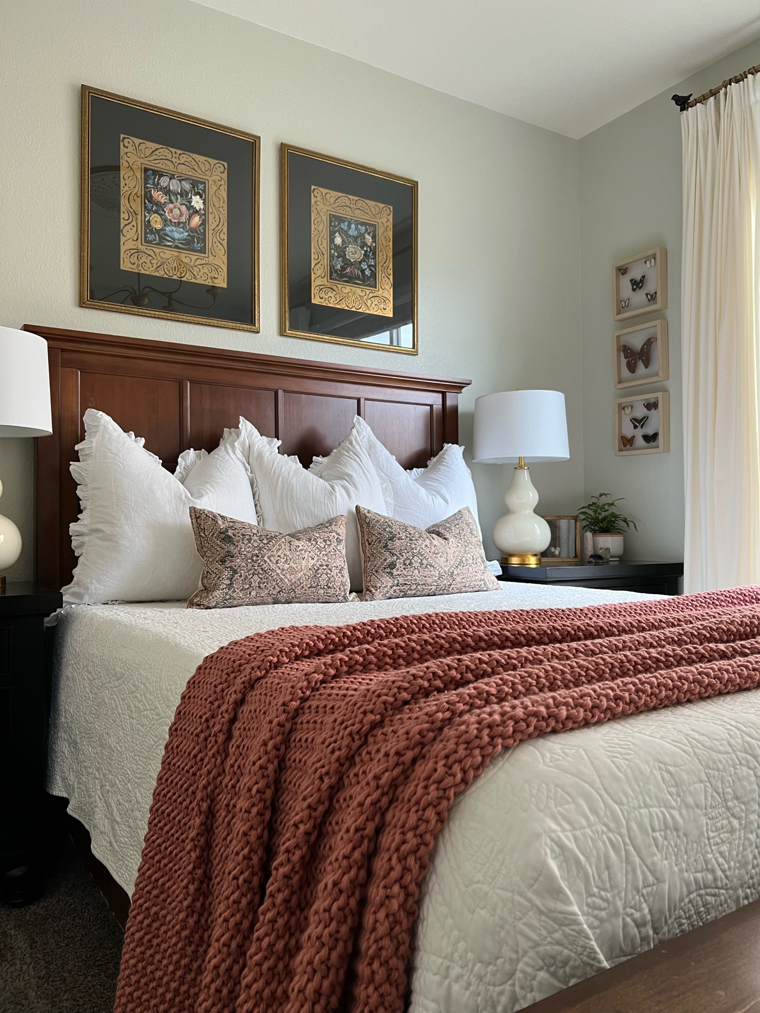 Teen girl bedroom or guest bedroom. Nature inspired. Queen bed, white bedding, white ruffle euro shams, Lumbar pillows, white table lamps, pink chunky knit throw blanket, butterfly wall art

#LTKhome