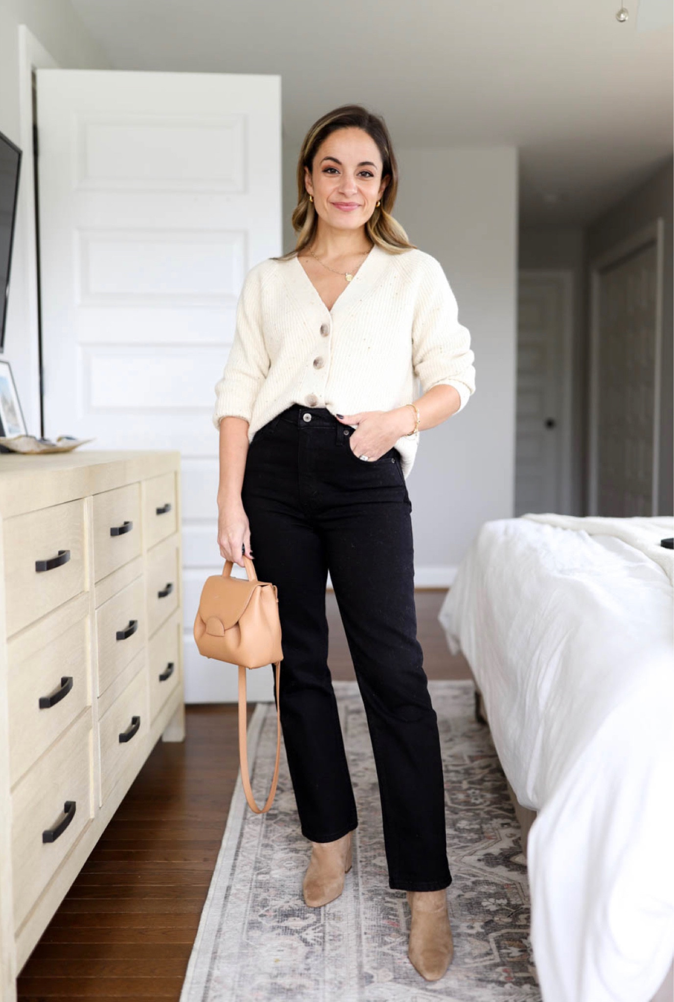  Capsule series: ways to wear black jeans 

Jeans: 24 extra short 
Sweater: petite xs 
Boots: tts 
Bag: (can’t link) polene un nano in textured tan 

#LTKstyletip #LTKSeasonal