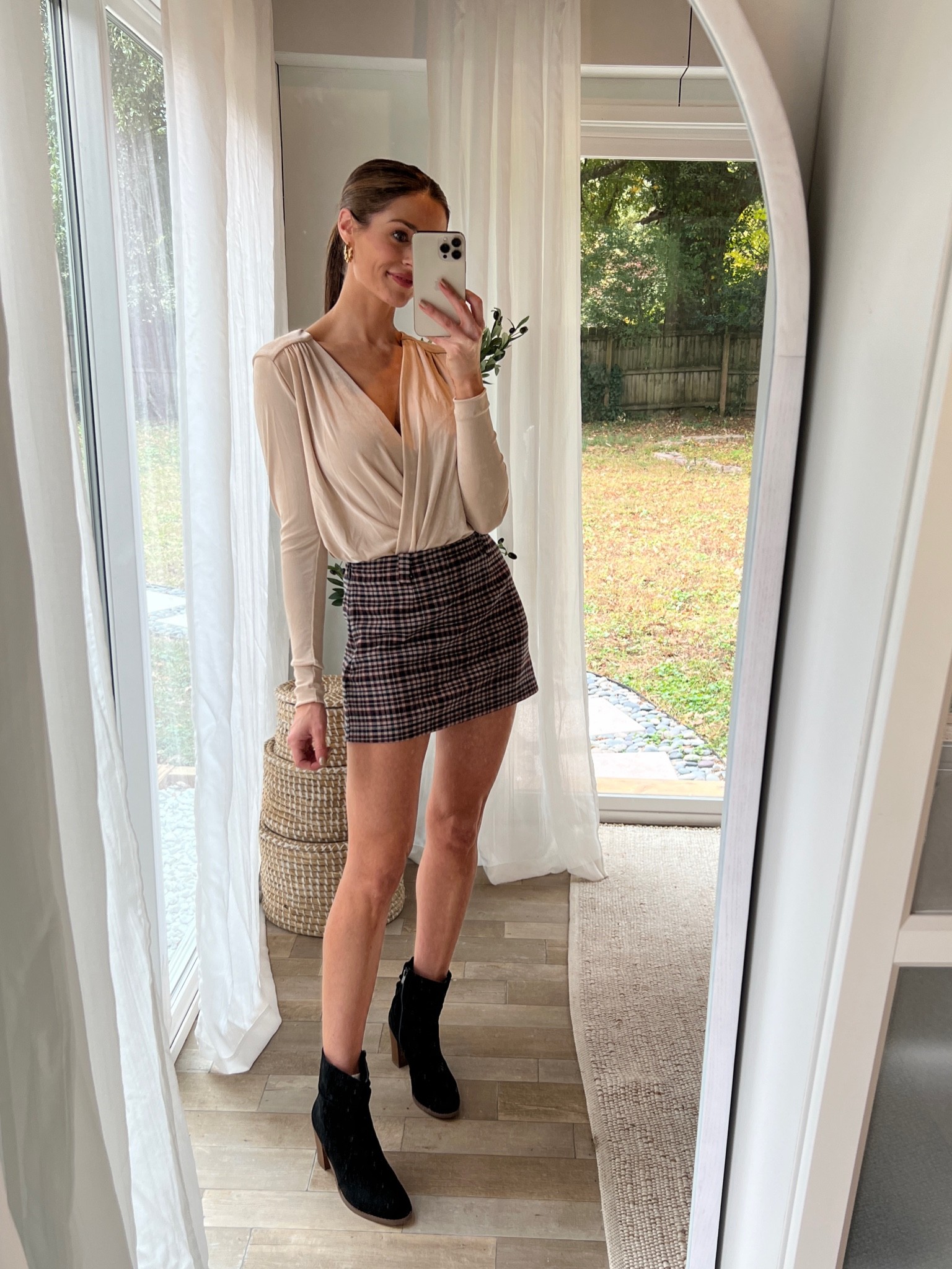 Nude free people bodysuit, plaid mini skort, fall outfit inspo, black booties 

Wearing XS in the bodysuit and skort!

#LTKunder50 #LTKstyletip