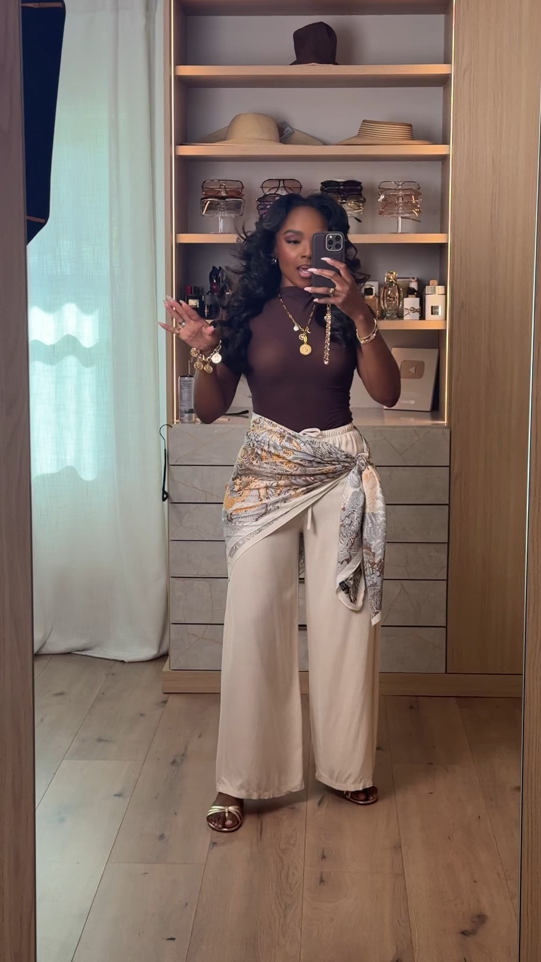 Vacation neutrals but make it elevated ✨🤎

The scarf styling detail completely transforms this look and gives that effortless luxury resort vibe without overdoing it. Lightweight cream trousers paired with layered gold jewelry and soft neutral tones always feel timeless and expensive.

Perfect for vacation dinners, beach resorts, rooftop cocktails, summer nights, brunch by the water, and luxury casual moments.

Resort wear outfit, neutral vacation outfit, scarf styling trend, elevated summer look, cream trousers outfit, effortless luxury aesthetic, European summer style, chic vacation fashion, classy neutral outfit ideas, wide leg pants outfit, feminine vacation style, old money summer aesthetic

Follow me on Instagram and YouTube @kirasfashionfinds