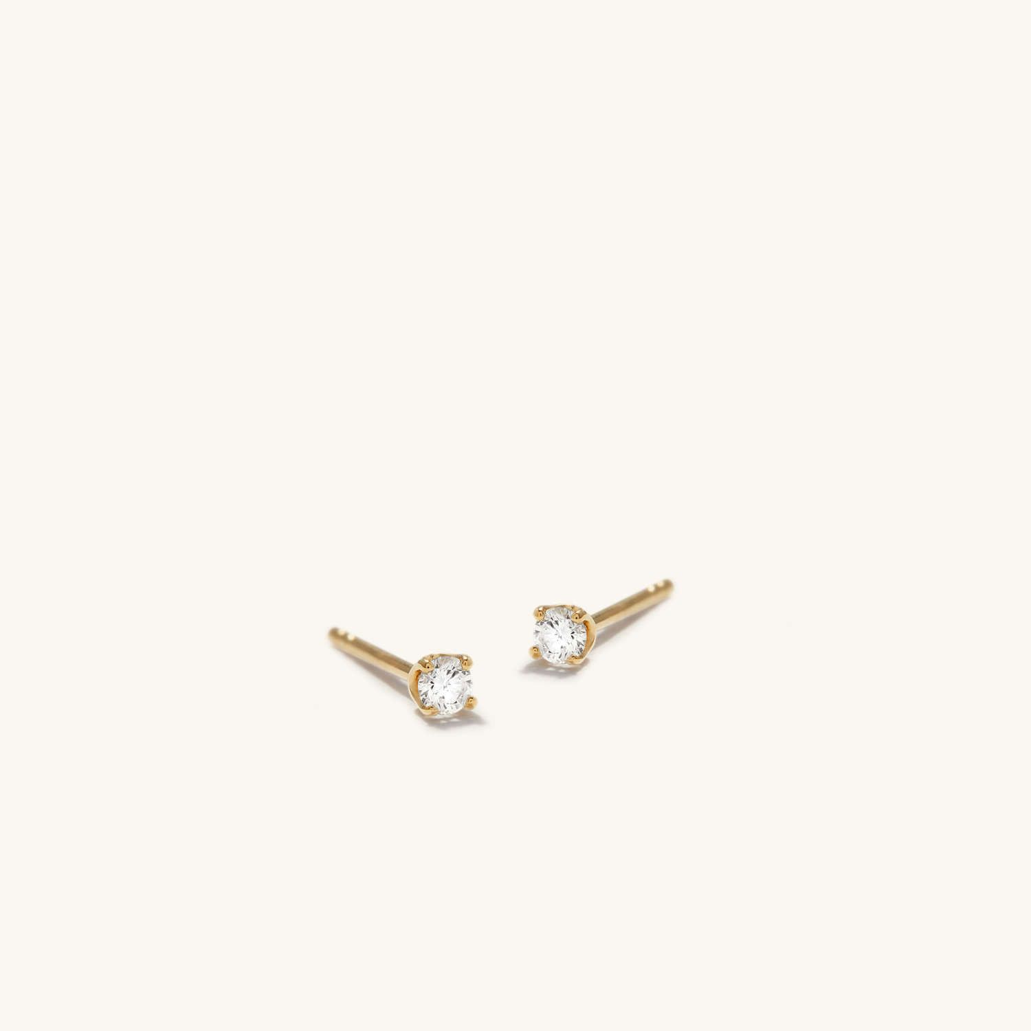 Diamond mini studs earrings in 14k yellow gold and diamond | Mejuri (Global)
