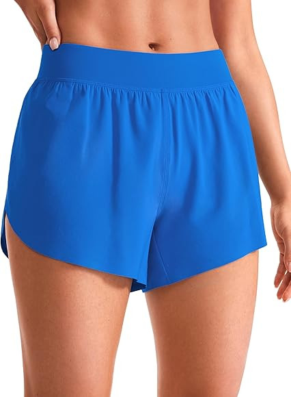 CRZ YOGA Mid Waisted Dolphin Athletic Shorts for Women 4" Lightweight High Split for Gym Workout ... | Amazon (US)