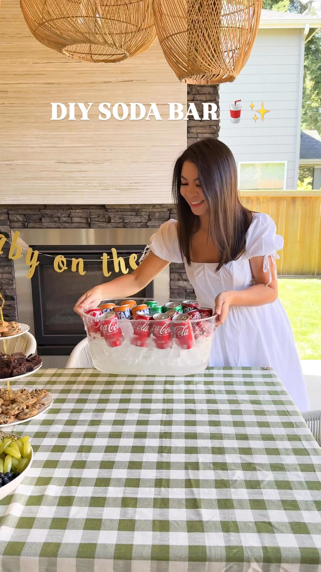 DIY SODA BAR FOR YOUR NEXT PARTY! Soda bars are all the rage right now, so we had to try one at the baby shower! Such a fun and easy way to make custom drinks for the mama-to-be and guests! Also, someone PLEASE do this for a K-pop Demon Hunters party as the Soda Pop station #sodabar #hostingideas #drinkbar

Checkered Tablecloth, hanging garland, sprite, coke, beverage tub, pump dispenser, Torani drink syrup soda, dr pepper, plastic cup, cake, dried flowers, bud vases, metal ice bucket, white dress, cake stand

#LTKSeasonal #LTKHome #LTKParties