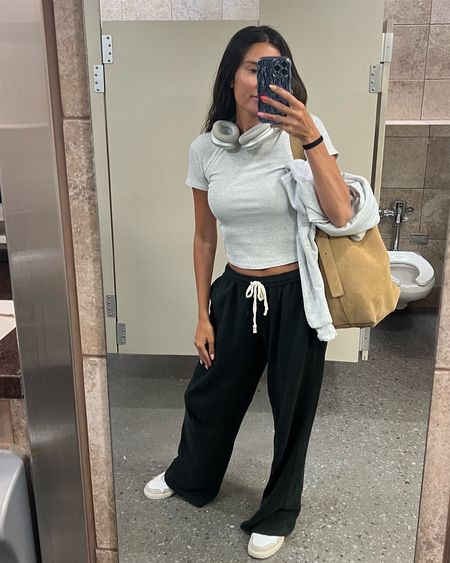 Comfy travel outfit 🖤 I love these black sweatpants - they’re so comfy and perfect for the airplane!  These white ASICS I’ve had for a long time and they’re one of my most comfortable white sneakers.
Obsessed with my new suede tan bucket bag - it looks really expensive and is under $200!😍

Travel outfit, airplane outfit, casual outfit, mom outfit, comfy outfit, vacation outfit, bucket bag, bucket tote, Madewell tote, John galt sweatpants, Vuori, Christine Andrew 

#LTKFindsUnder100 #LTKStyleTip #LTKTravel