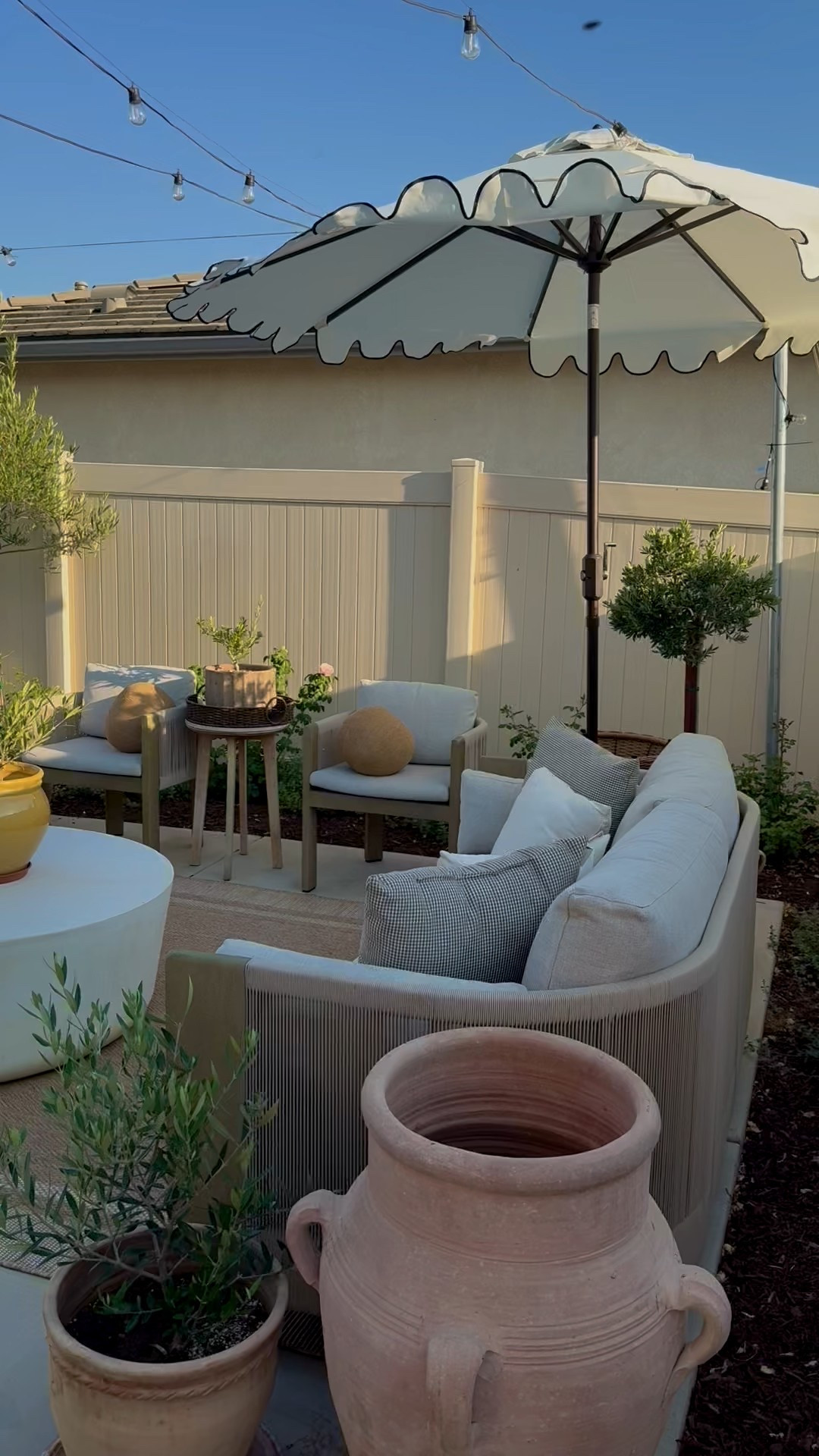 In my Nancy meyers era 🤍 the sweetest scalloped umbrella from Walmart! #outdoor #umbrella #backyard #nancymeyersera 

#LTKHome